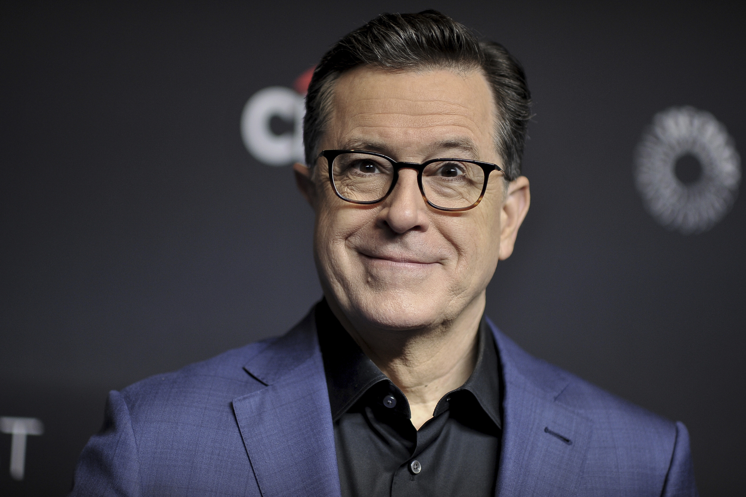 FILE - Stephen Colbert attends the 36th Annual PaleyFest "An Evening with Stephen Colbert" in Los Angeles on March 16, 2019. Colbert says that his staff members arrested at a congressional office building last week were guilty of ‘first-degree puppetry.’ His ‘Late Show’ monologue Monday was his first time addressing the Thursday incident. U.S. Capitol Police detained comics including the voice of Triumph the Insult Comic Dog. (Photo by Richard Shotwell/Invision/AP, File)