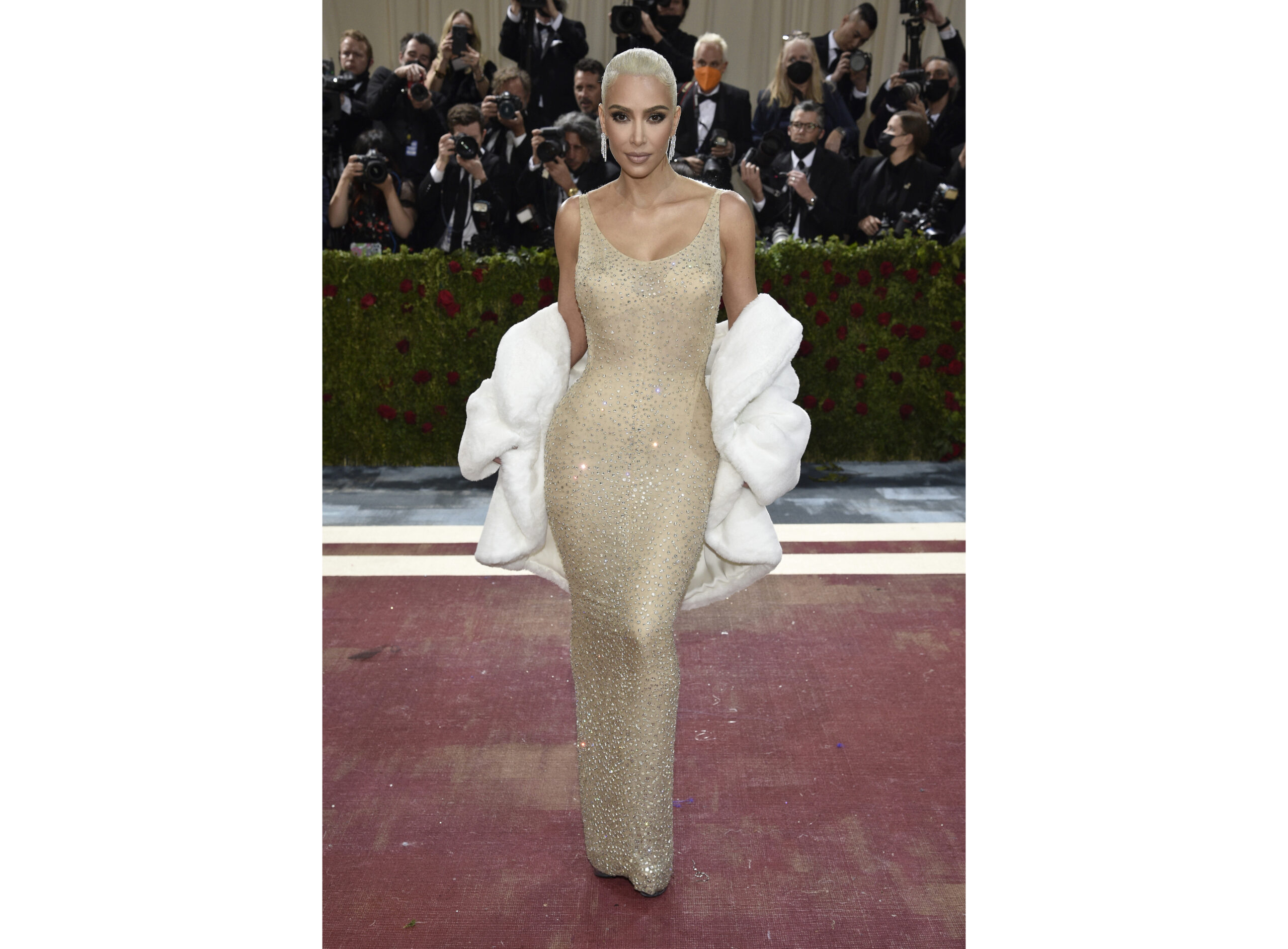 FILE - Kim Kardashian wears the iconic dress worn by Marilyn Monroe at The Metropolitan Museum of Art's Costume Institute benefit gala in New York on May 2, 2022. Some Monroe enthusiasts believe the dress was damaged after Kardashian wore it but the Ripley’s Believe It or Not! attraction in Hollywood, Calif., where the garment is on display, denies that claim. (Photo by Evan Agostini/Invision/AP, File)
