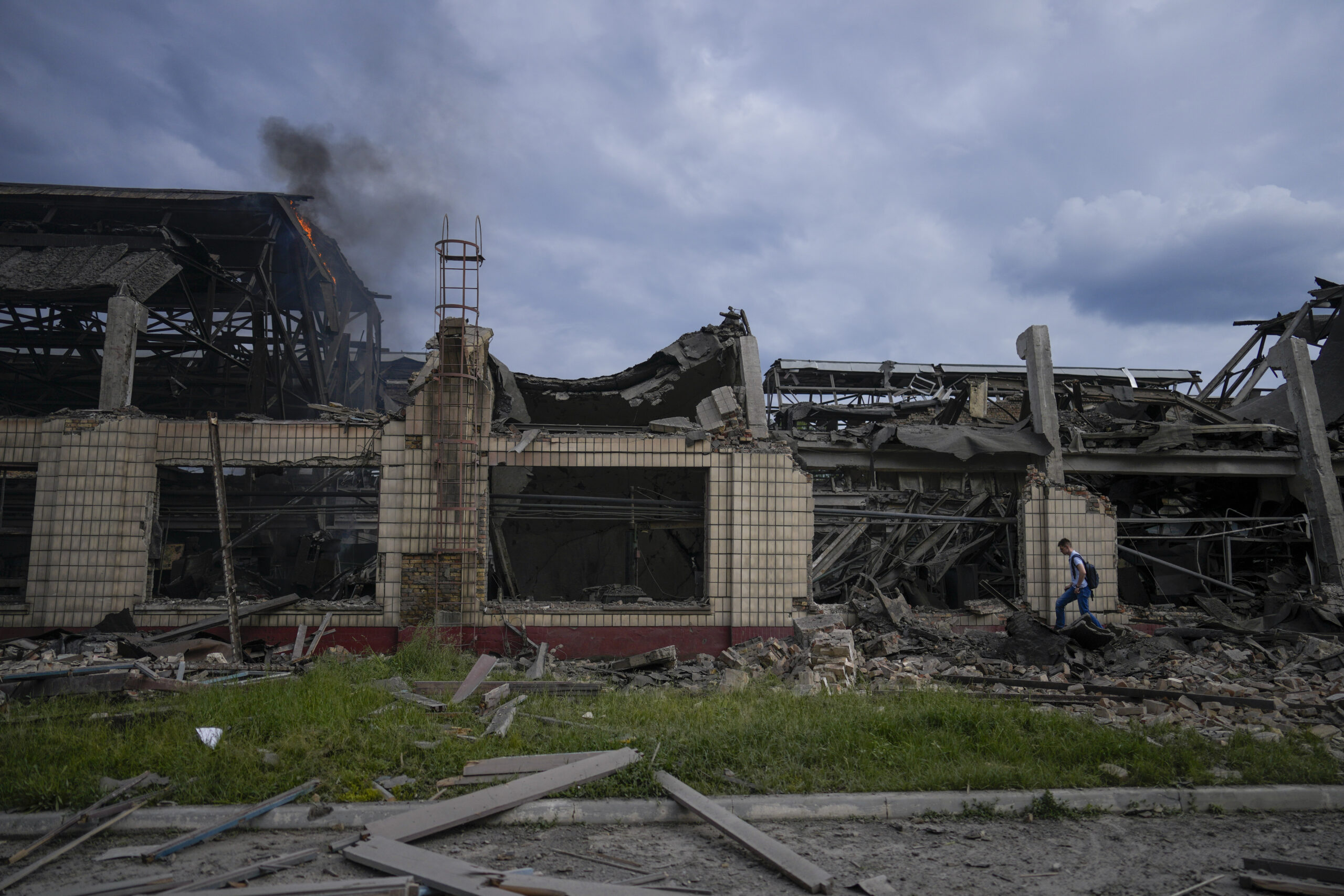 Smokes raises from a railway service facility hit by a Russian missile strike in Kyiv, Ukraine, Sunday, June 5, 2022. (AP Photo/Natacha Pisarenko)
