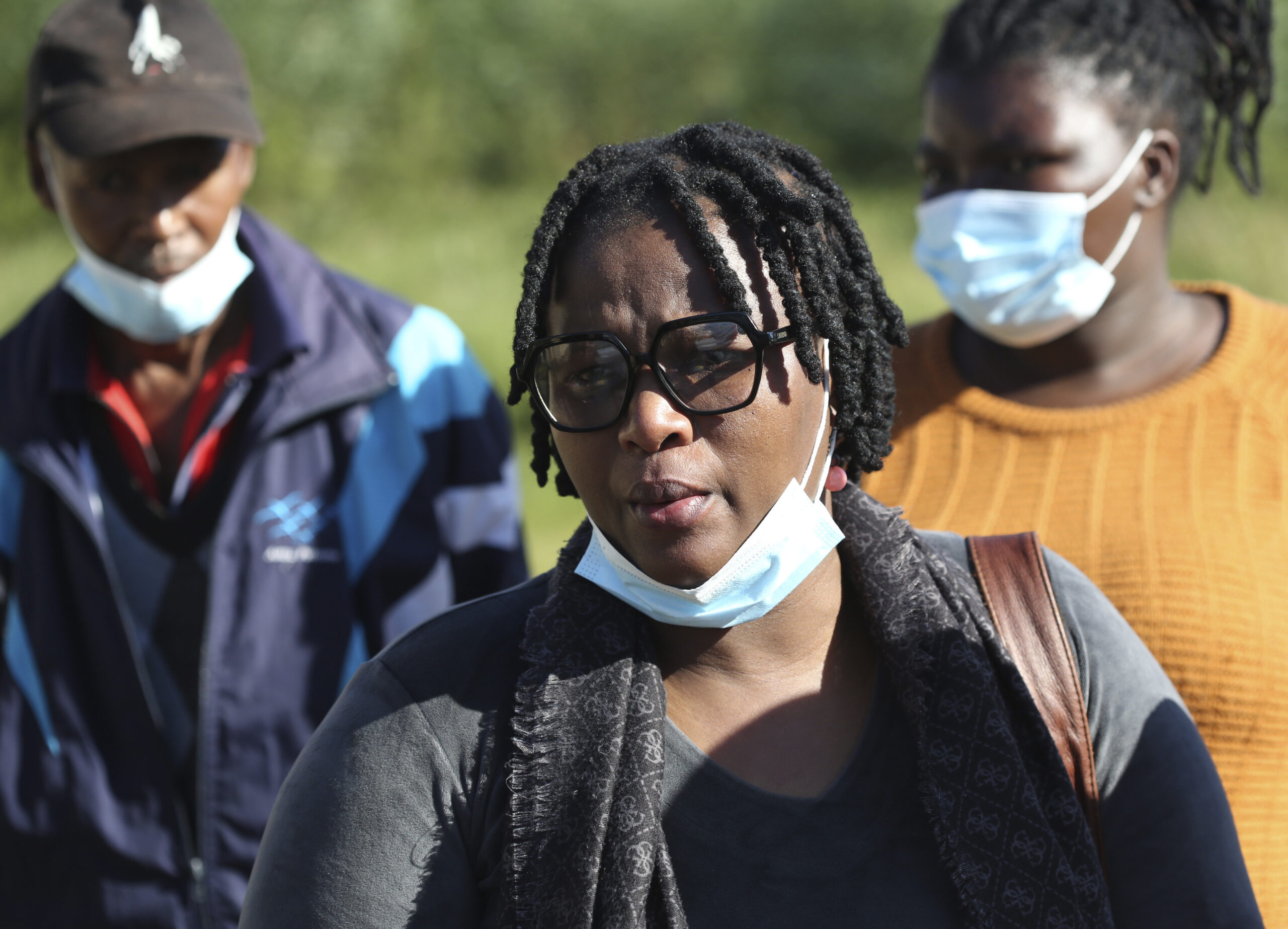Yandiswa Ngqoza, with family members after identifying her daughters at the Woodbrook Mortuary in East London, South Africa Monday, June 27, 2022. South African authorities are seeking answers after 21 underage teenagers celebrating the end of school exams died in a mysterious weekend incident at a nightclub. The bodies of many of the victims were discovered by police lying on tables, slumped over chairs and sprawled on the floor of the club in the early hours of Sunday morning. (AP Photo)