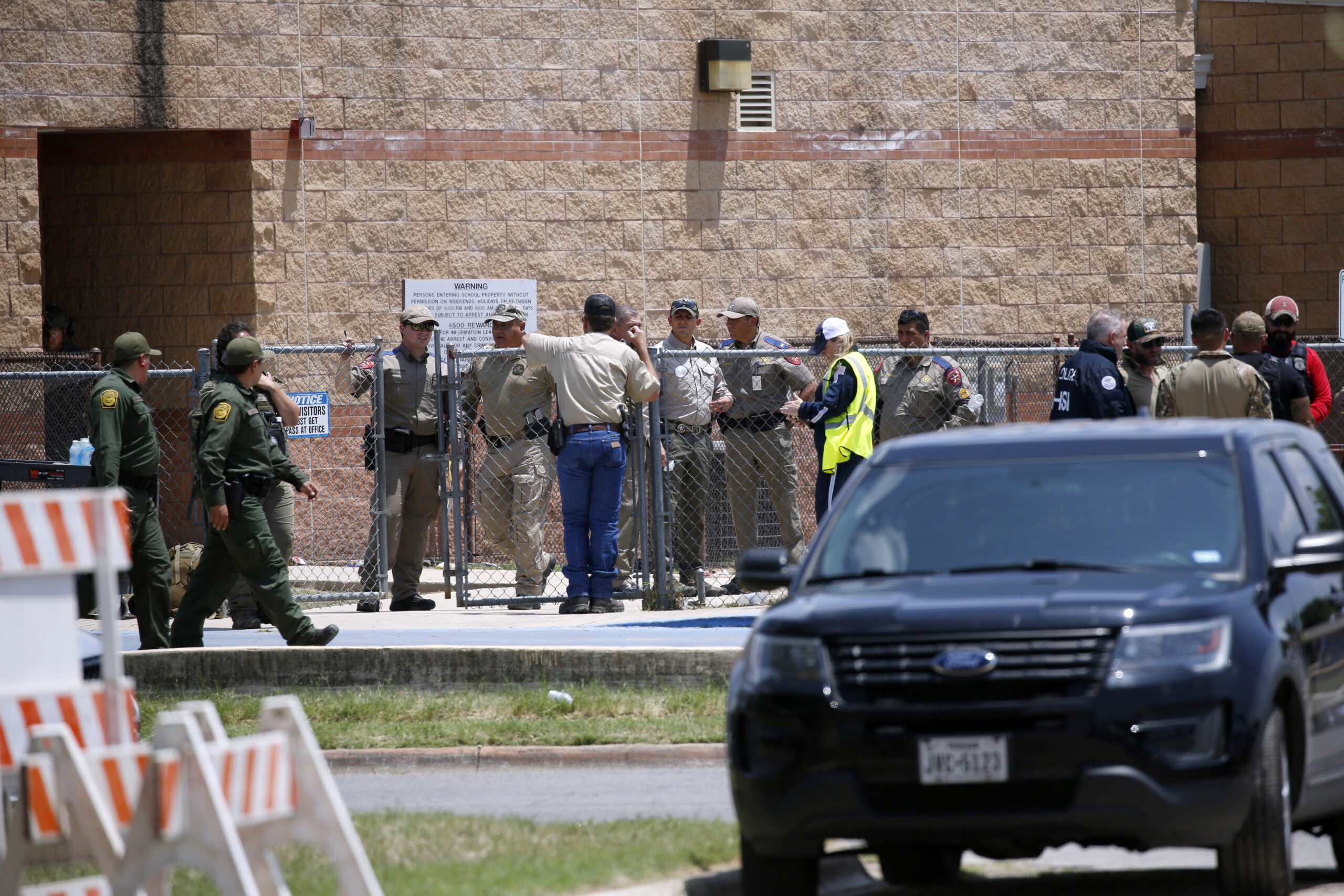 FILE - Law enforcement, and other first responders, gather outside Robb Elementary School following a shooting, on May 24, 2022, in Uvalde, Texas. Law enforcement authorities had enough officers on the scene of the Uvalde school massacre to have stopped the gunman three minutes after he entered the building, the Texas public safety chief testified Tuesday, June 21 pronouncing the police response an “abject failure.”(AP Photo/Dario Lopez-Mills, File)