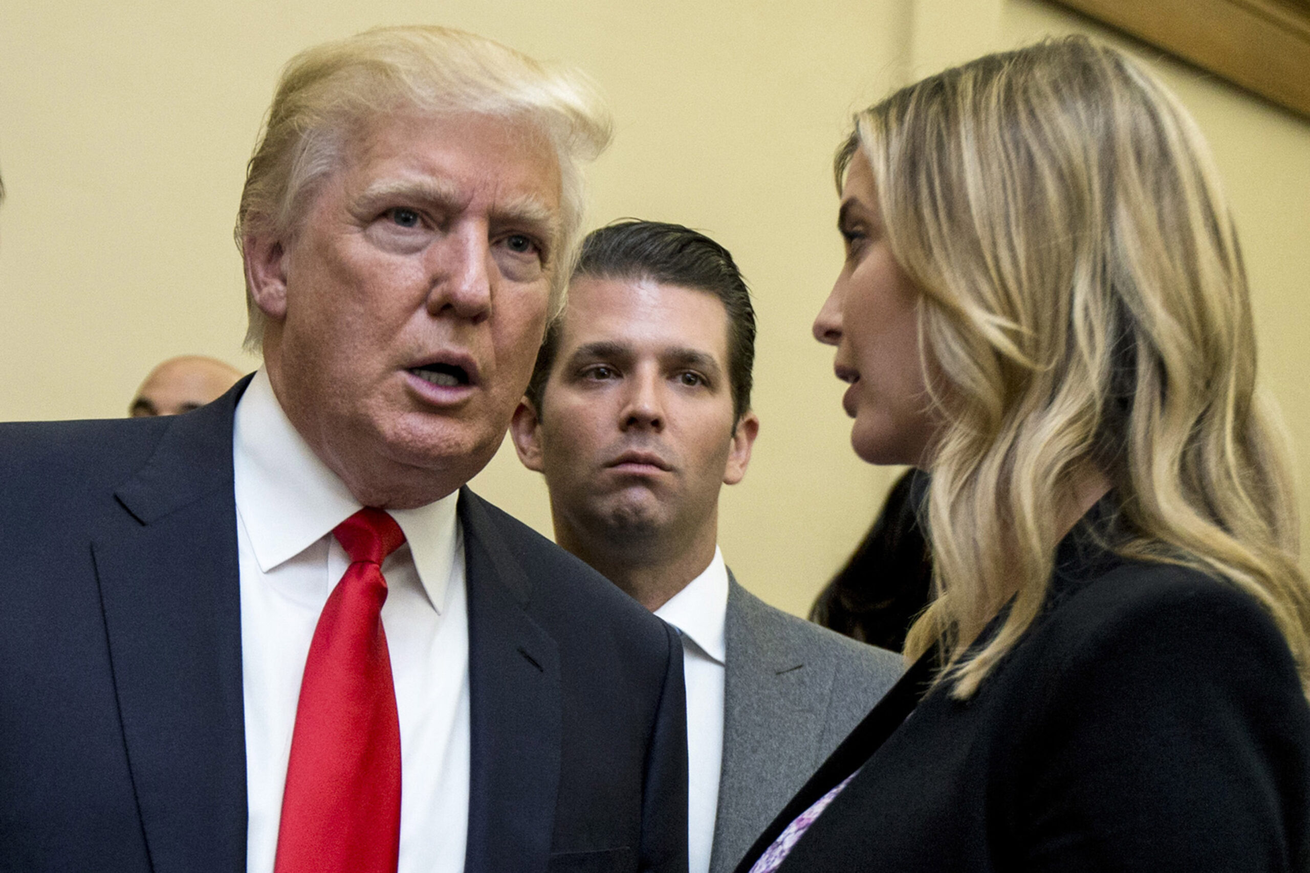 FILE - Donald Trump, left, his son Donald Trump Jr., center, and his daughter Ivanka Trump speak during the unveiling of the design for the Trump International Hotel in the The Old Post Office, in Washington, on Sept. 10, 2013. The former, his namesake son and his daughter have agreed to answer questions under oath next month in the New York attorney general's civil investigation into his business practices, unless their lawyers persuade the state's highest court to step in. A Manhattan judge signed off Wednesday, June 8, 2022, on an agreement that calls for the Trumps to give depositions — a legal term for sworn, pretrial testimony out of court — starting July 15. (AP Photo/Manuel Balce Ceneta, File)