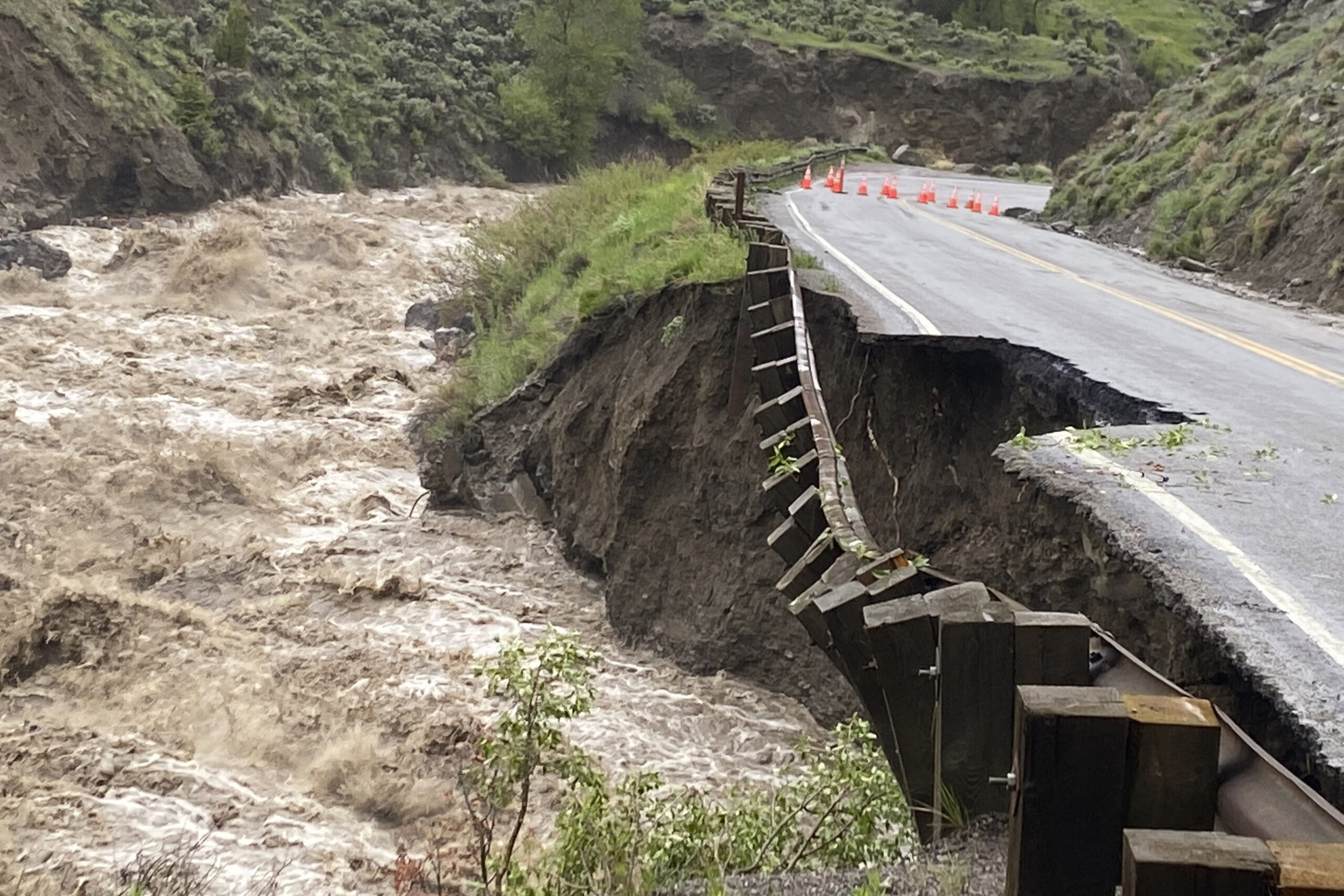 In this photo provided by the National Park Service, is high water in the Gardiner River along the North Entrance to Yellowstone National Park in Montana, that washed out part of a road on Monday, June 13, 2022. (National Park Service via AP)