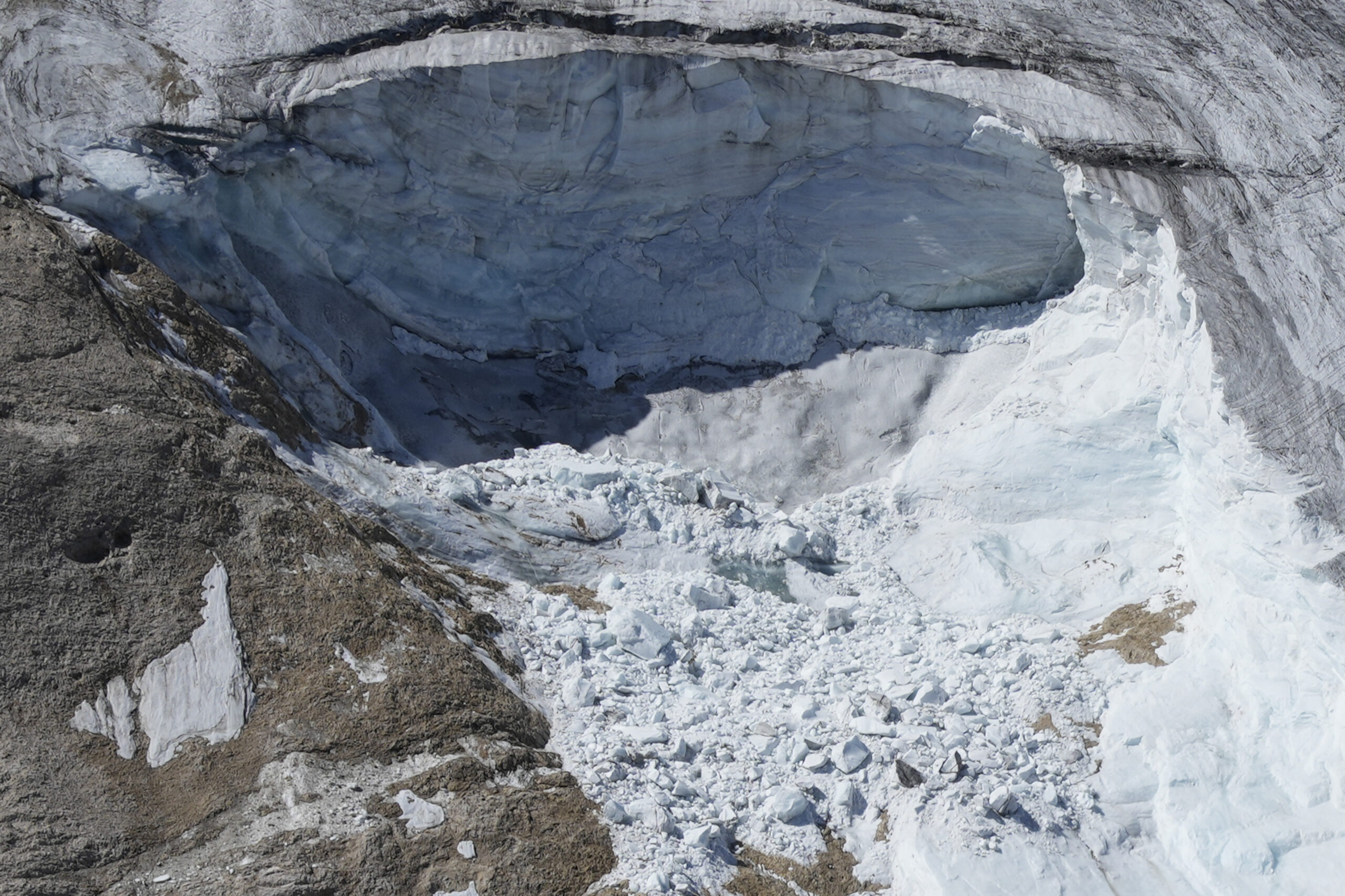 A view taken from a rescue helicopter of the Punta Rocca glacier near Canazei, in the Italian Alps in northern Italy, Tuesday, July 5, 2022, two day after a huge chunk of the glacier broke loose, sending an avalanche of ice, snow, and rocks onto hikers. (AP Photo/Luca Bruno)