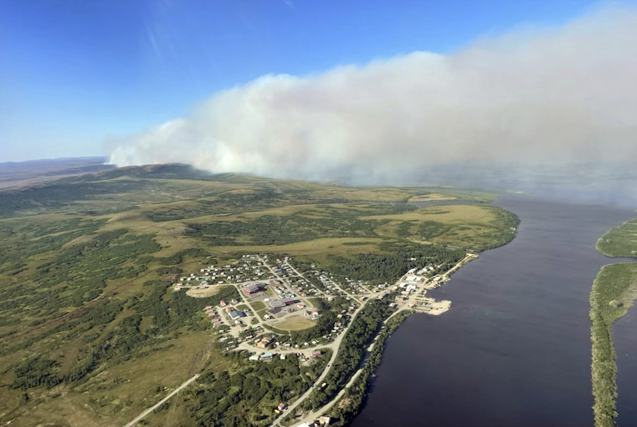 FILE - This aerial photo provided by the Bureau of Land Management Alaska Fire Service shows a tundra fire burning near the community of St. Mary's, Alaska, on June 10, 2022. Alaska's remarkable wildfire season includes over 530 blazes that have burned an area more than three times the size of Rhode Island, with nearly all the impacts, including dangerous breathing conditions from smoke, attributed to fires started by lightning. (Ryan McPherson/Bureau of Land Management Alaska Fire Service via AP, File)