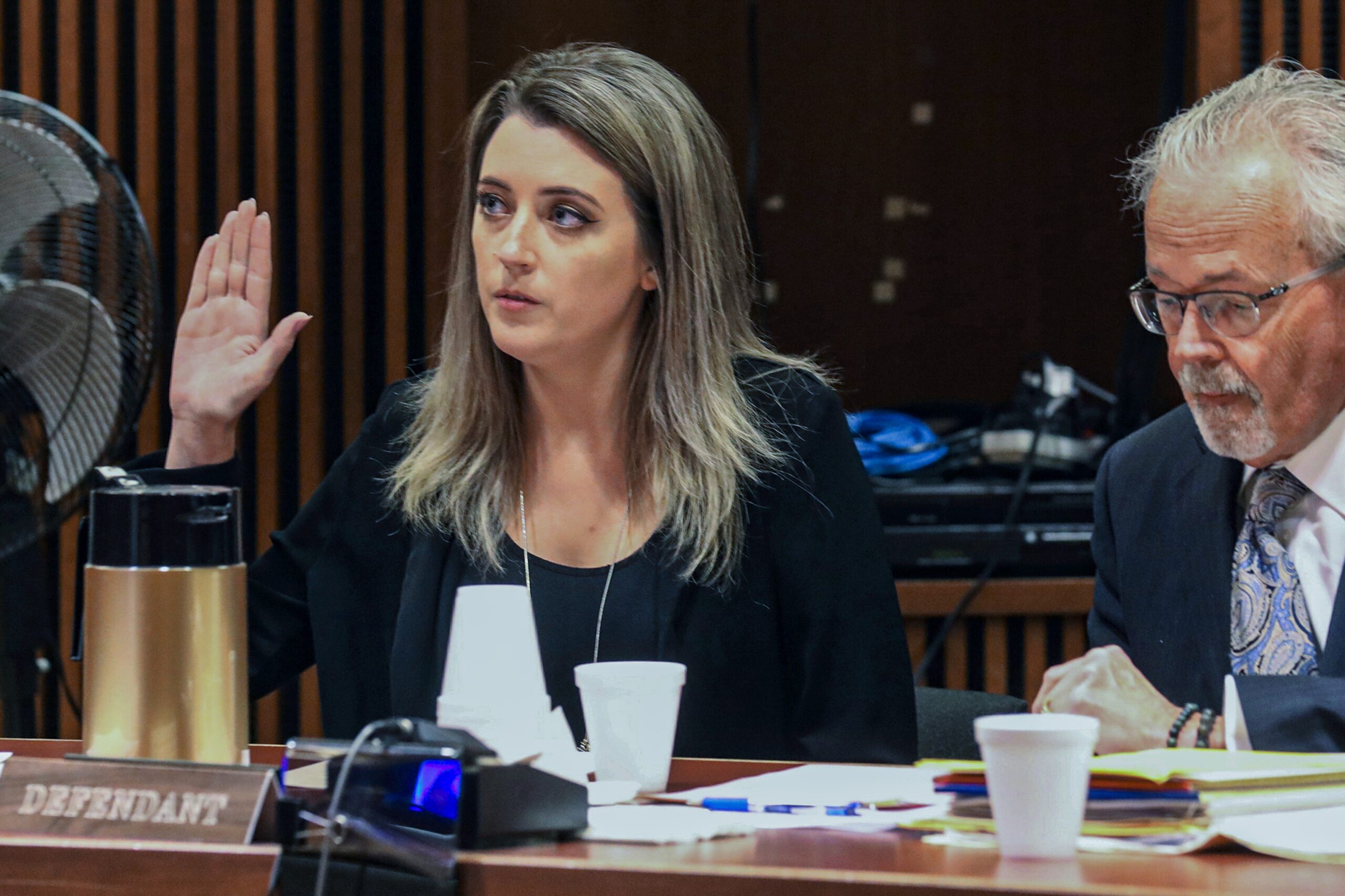 Kate McClure, 32, charged with theft by deception in the $400,00 GoFundMe scam, with her lawyer Jim Gerrow Jr., in State Superior Court, Burlington County Courthouse, Mt. Holly, N.J., April 15, 2019. A New Jersey judge sentenced McClure to a term of one year and one day in prison, for her role in the scam using a fake story about Johnny Bobbitt who was a homeless veteran. (David Swanson/The Philadelphia Inquirer via AP, fILE)