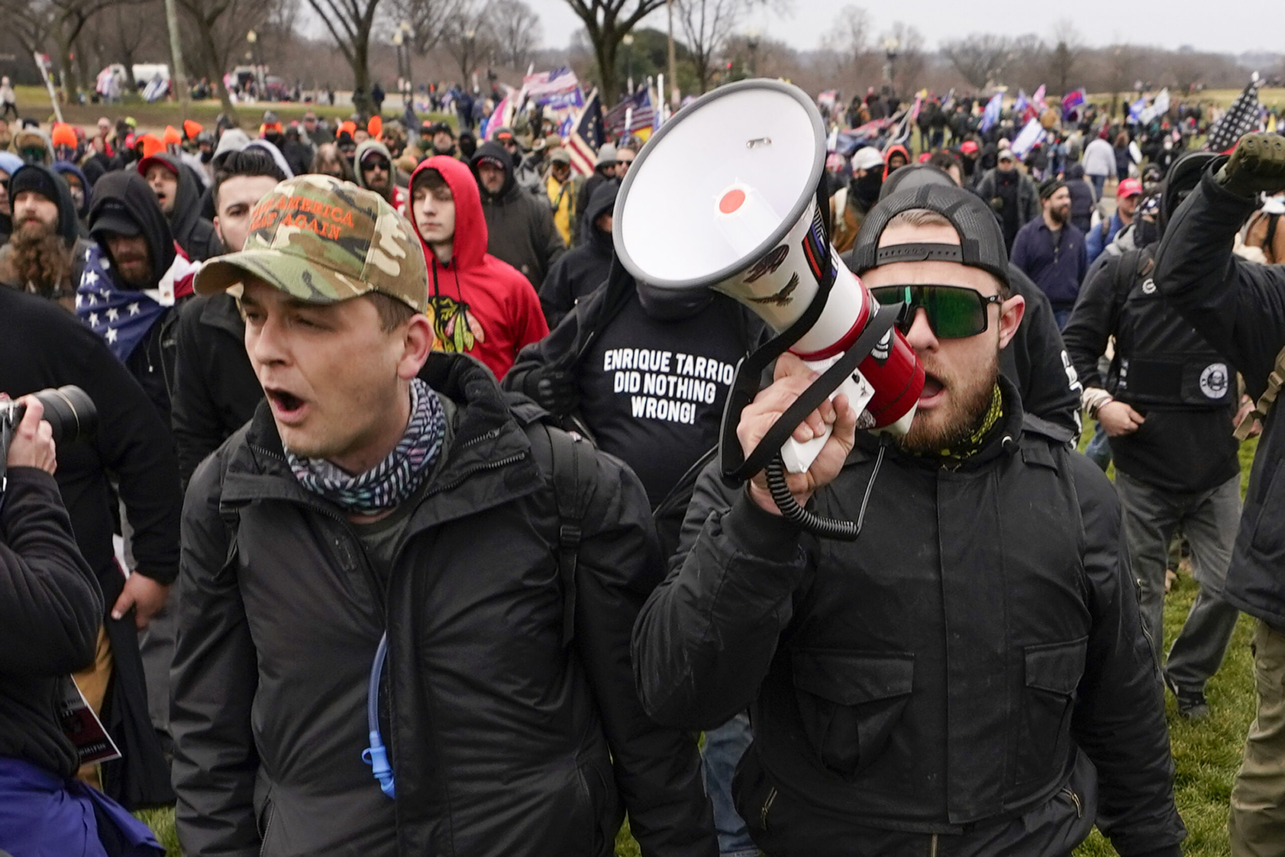FILE - Proud Boys members Zachary Rehl, left, and Ethan Nordean, left, walk toward the U.S. Capitol in Washington, in support of President Donald Trump, Jan. 6, 2021. An upcoming hearing of the U.S. House Committee probing the Jan. 6 insurrection is expected to examine ties between people in former President Donald Trump's orbit and extremist groups who played a role in the Capitol riot. (AP Photo/Carolyn Kaster, File)
