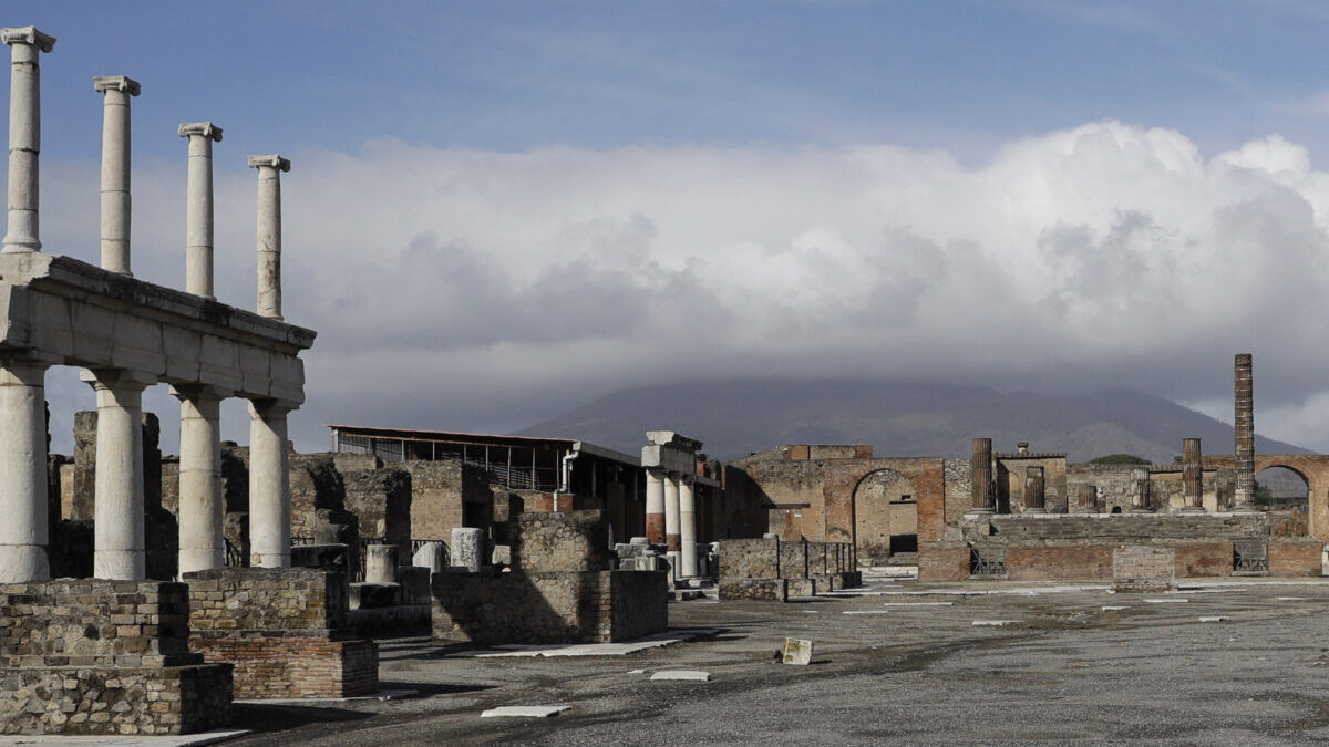 FILE - Clouds hang over the Vesuvius volcano in Pompeii, southern Italy, Jan. 25, 2021. An American tourist had to be rescued on Mount Vesuvius near Naples after he apparently slipped into the volcano’s crater while trying to recover his fallen cellphone, news reports and the association of Vesuvius park guides said. The tourist and family members were cited by Carabinieri police because they went off the authorized path to get closer to the crater on Saturday, July 9, 2022 apparently to take a selfie, Italian news reports said. (AP Photo/Gregorio Borgia, file)