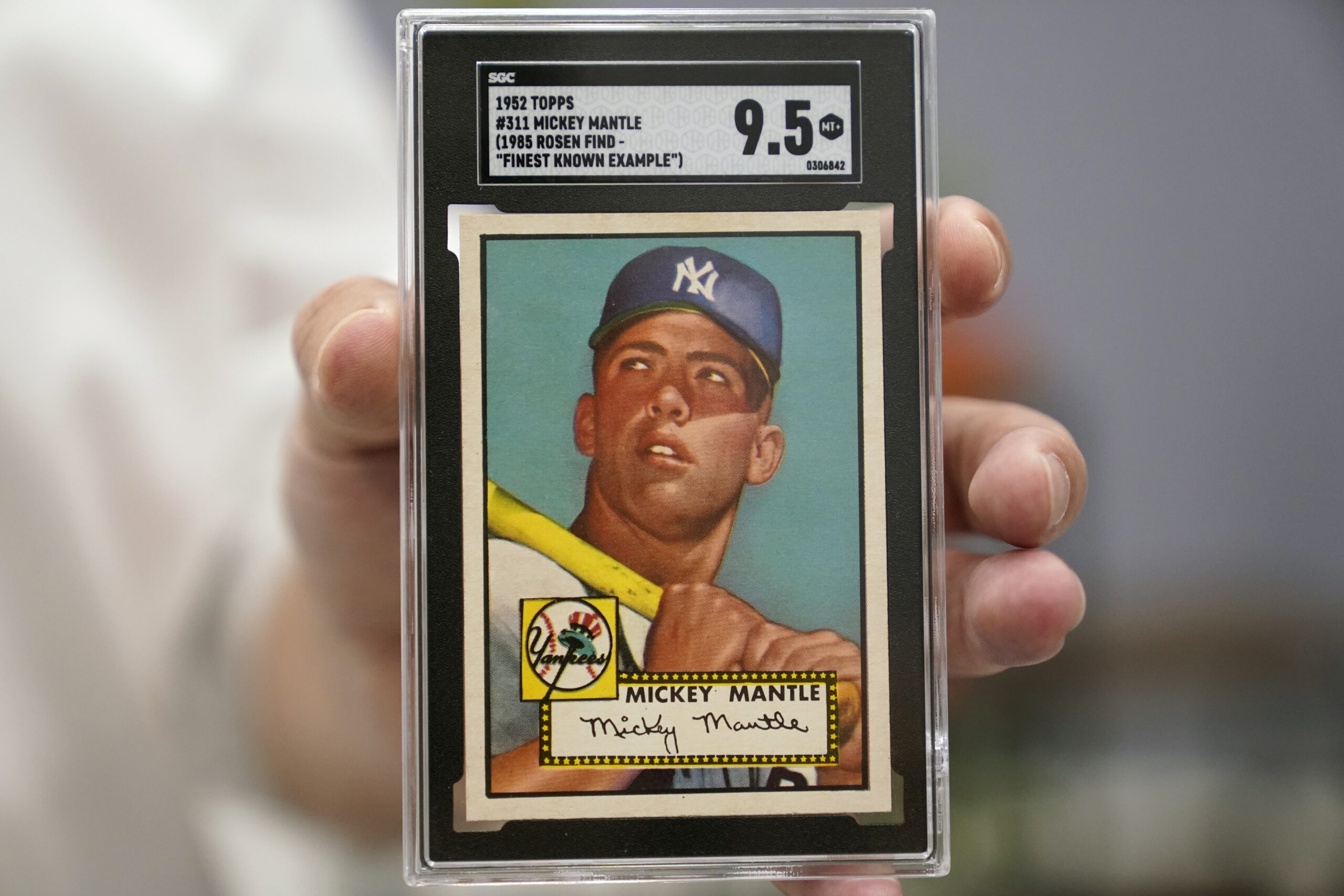 A Mickey Mantle baseball card is displayed at Heritage Auctions in Dallas, Thursday, July 21, 2022. The mint-condition Mantle card is expected to sell well into the millions when bidding ends at the end of the month. (AP Photo/LM Otero)