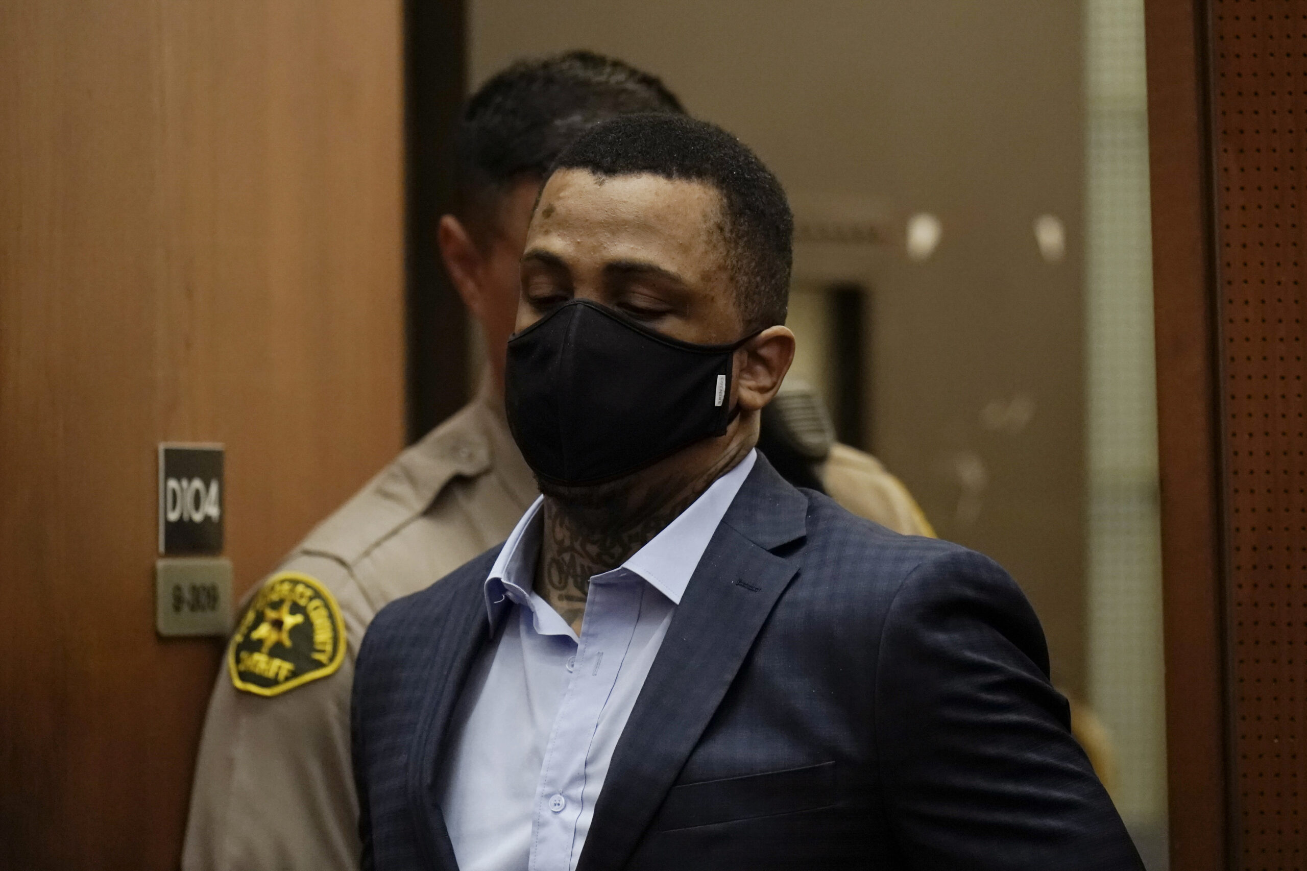 Eric Holder Jr., who is accused of killing rapper Nipsey Hussle, enters a courtroom to hear the verdicts in his murder trial at Los Angeles Superior Court in Los Angeles, Wednesday, July 6, 2022. Jurors have found the 32-year-old man guilty of first-degree murder for the 2019 fatal shooting of the rapper. (AP Photo/Jae C. Hong, Pool)