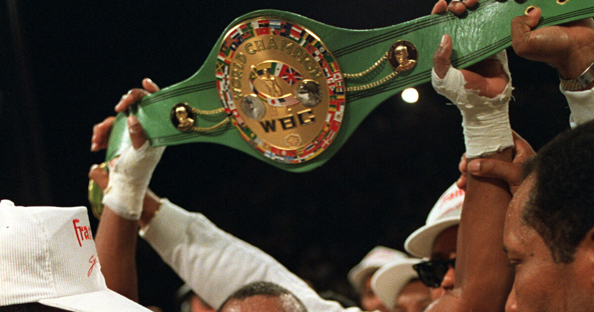 FILE — Sugar Ray Leonard, U.S.A., holds the middleweight championship belt above his head after defeating Marvin Hagler in a split decision to win the title in Las Vegas, Nev., April 6, 1987. A World Boxing Council championship belt belonging to former South African President Nelson Mandela has been stolen from a museum in Soweto. The belt was given to Mandela by American boxing legend Leonard during one of his visits to South Africa. (AP Photo/Lennox McLendon/File)