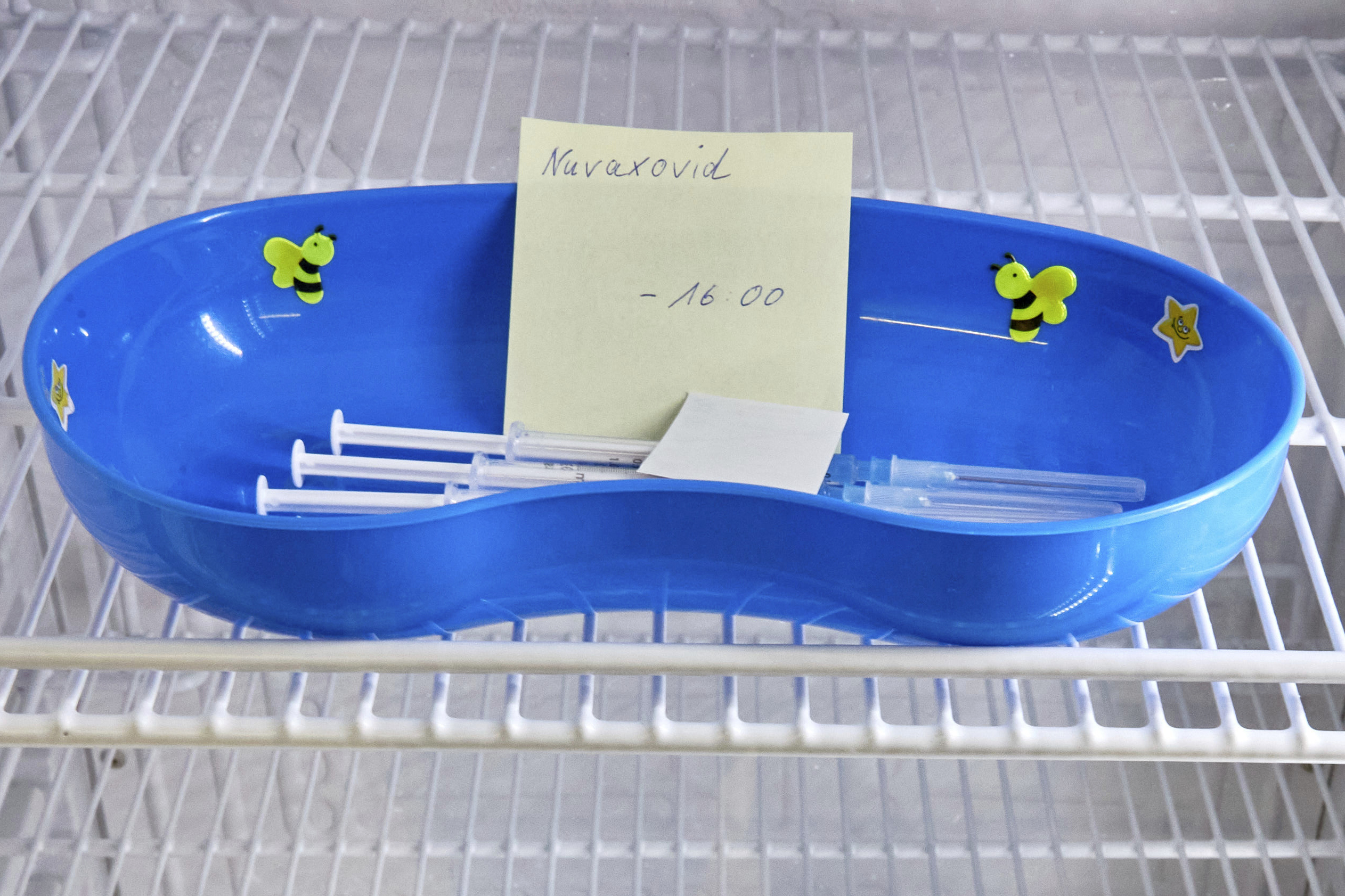 FILE - A kidney dish with syringes containing the Novavax COVID-19 vaccine sits in a refrigerator ready for use at a vaccination center in Prisdorf, Germany, Saturday, Feb. 26, 2022. On Tuesday, July 19, 2022, a U.S. Centers for Disease Control and Prevention advisory panel recommended the shots and final action will come from the agency's director. (Georg Wendt/dpa via AP, File)