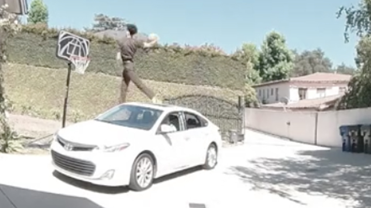 A TikTok video reposted by ESPN appeared to show a UPS driver dunking a basketball over a car in a driveway after scanning a package with a calculator app.