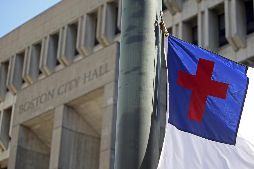 The Christian Flag is raised at City Hall Plaza Wednesday, Aug. 3, 2022 in Boston.