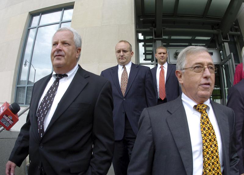 FILE - In this Tuesday, Sept., 15, 2009, file photo, former Luzerne County Court Judges Michael Conahan, front left, and Mark Ciavarella, front right, leave the United States District Courthouse in Scranton, Pa.