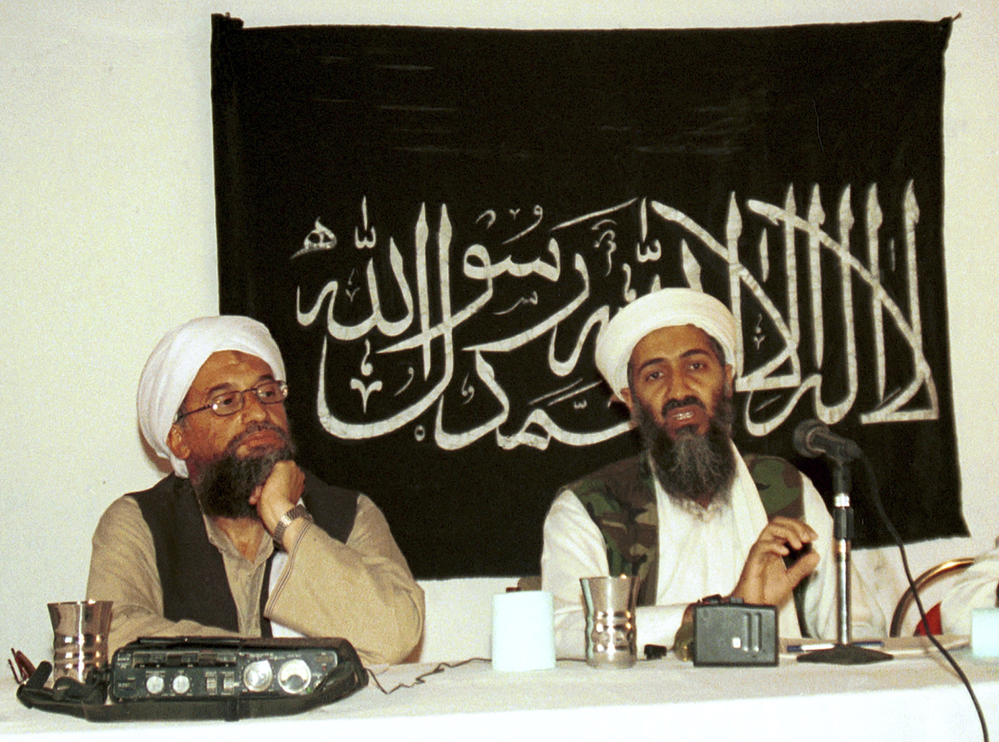 FILE - In this 1998 file photo made available Friday, March 19, 2004, Ayman al-Zawahri, left, listens during a news conference with Osama bin Laden in Khost, Afghanistan. A U.S. airstrike has killed al-Qaida leader Ayman al-Zawahri in Afghanistan, according to a person familiar with the matter. President Joe Biden will speak about the operation on Monday night, Aug. 1, 2022, from the White House. (AP Photo/Mazhar Ali Khan, File)