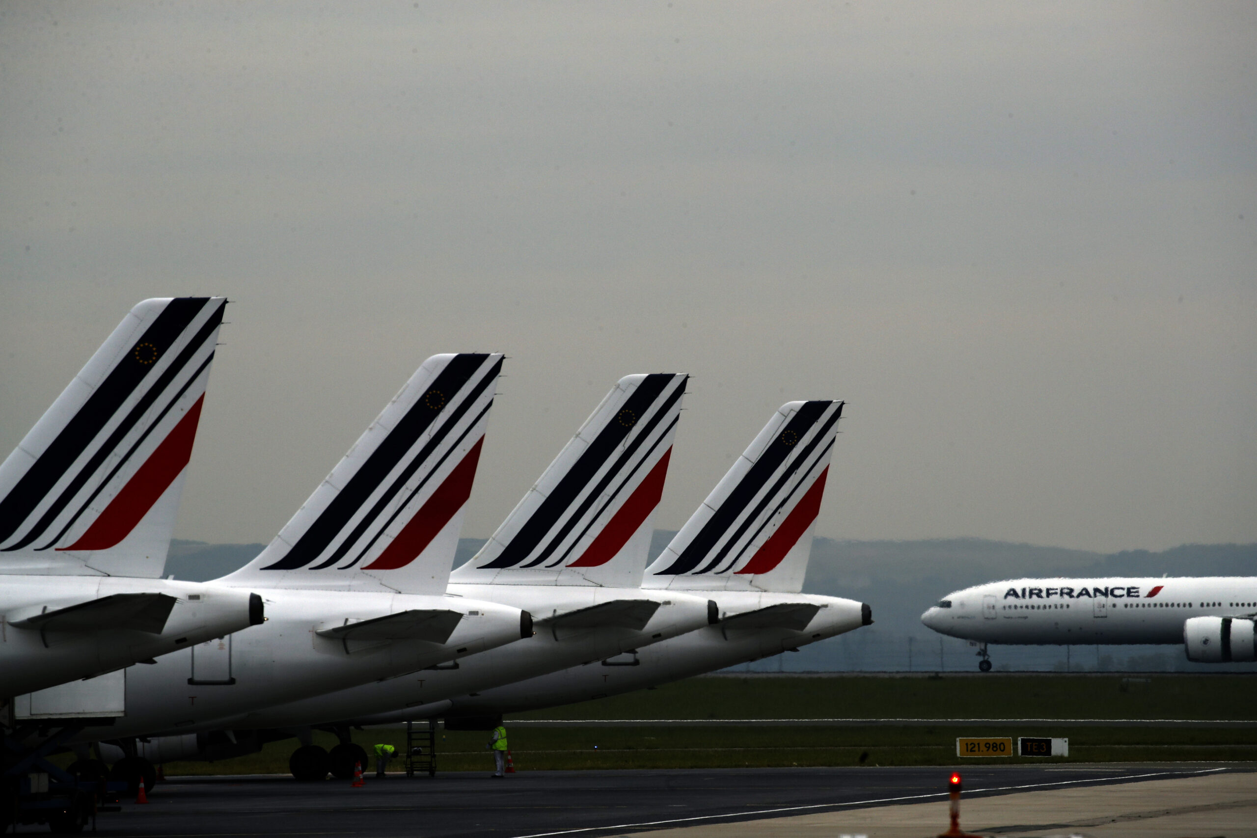 FILE - Air France planes are parked on the tarmac at Paris Charles de Gaulle airport, in Roissy, near Paris, May 17, 2019. Air France pilots are under scrutiny after recent incidents that have prompted French investigators to call for tougher safety protocols. An airline official said two Air France pilots were suspended after physically fighting in the cockpit on a Geneva-Paris flight in June, 2022. (AP Photo/Christophe Ena, File)
