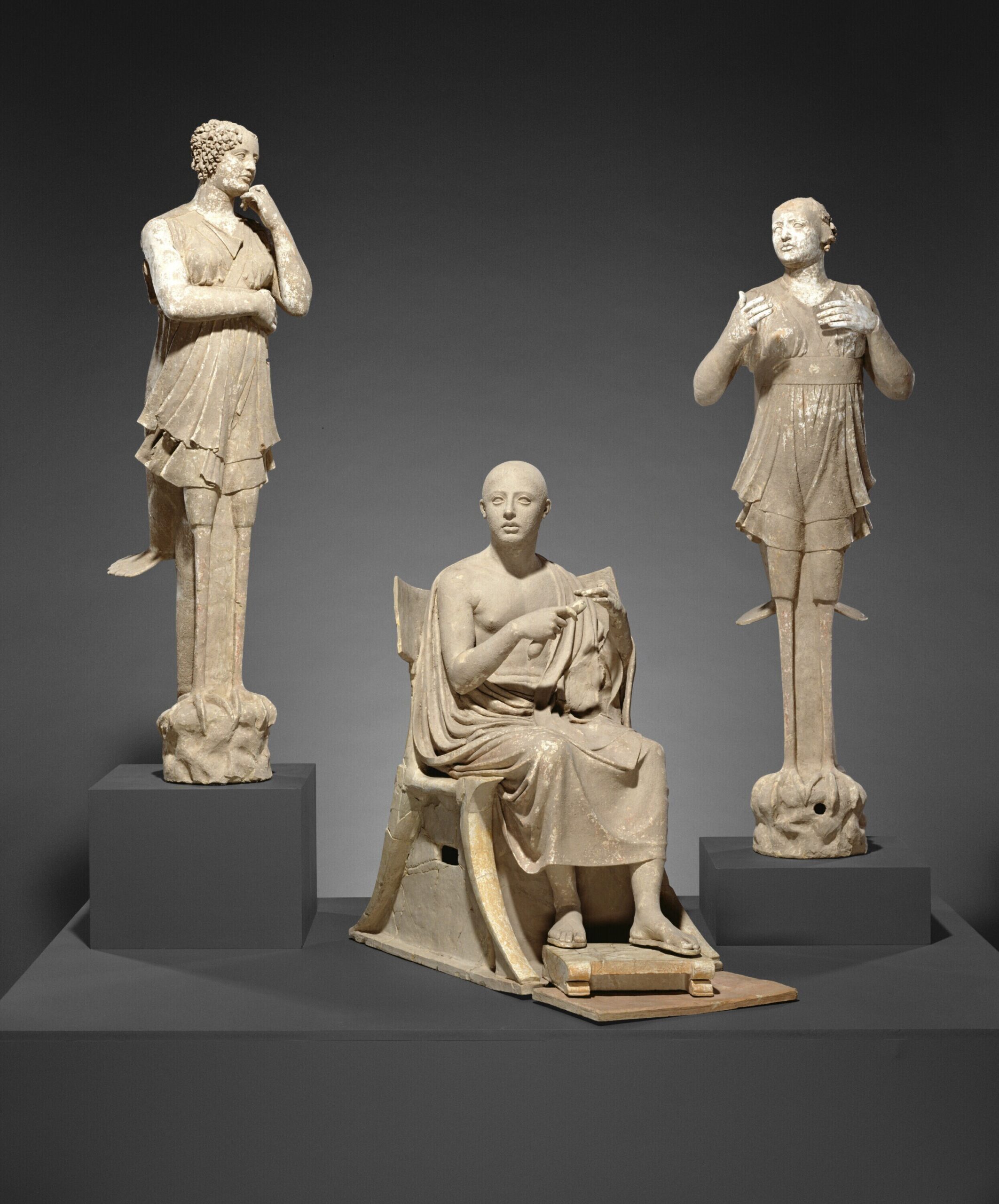 This undated photo provided by The J. Paul Getty Museum shows Sculptural Group of a Seated Poet and Sirens. The J. Paul Getty Museum in Los Angeles is returning ancient sculptures and other works of art that were illegally exported from Italy. The museum announced Thursday, Aug. 11, 2022, that next month it will ship back the nearly life-size group of statues known as "Orpheus and the Sirens." (The J. Paul Getty Museum via AP)