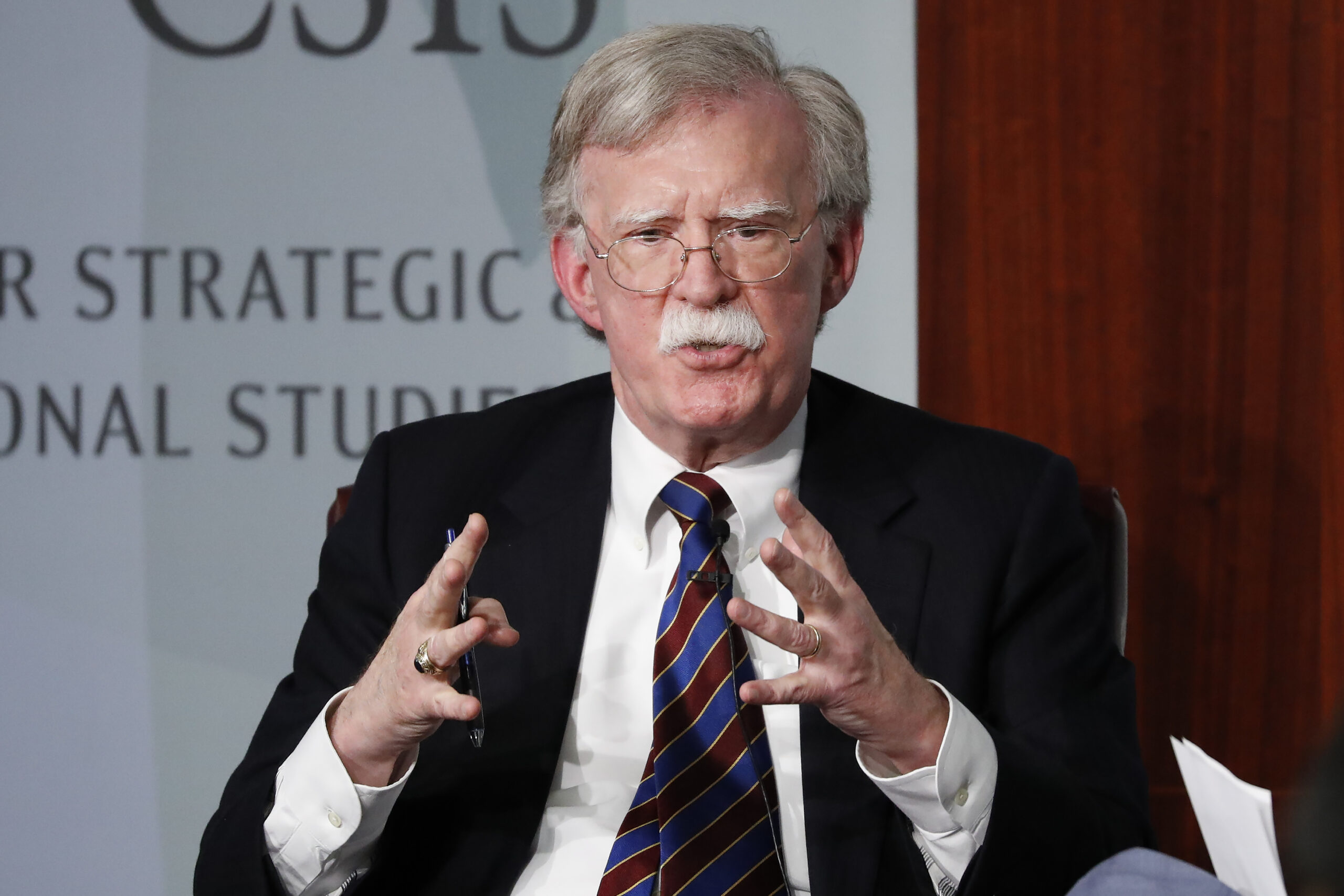 FILE - Former National security adviser John Bolton gestures while speaking at the Center for Strategic and International Studies (CSIS) in Washington, Sept. 30, 2019. The Justice Department says an Iranian operative has been charged in a plot to murder former Trump administration national security John Bolton. (AP Photo/Pablo Martinez Monsivais, File)