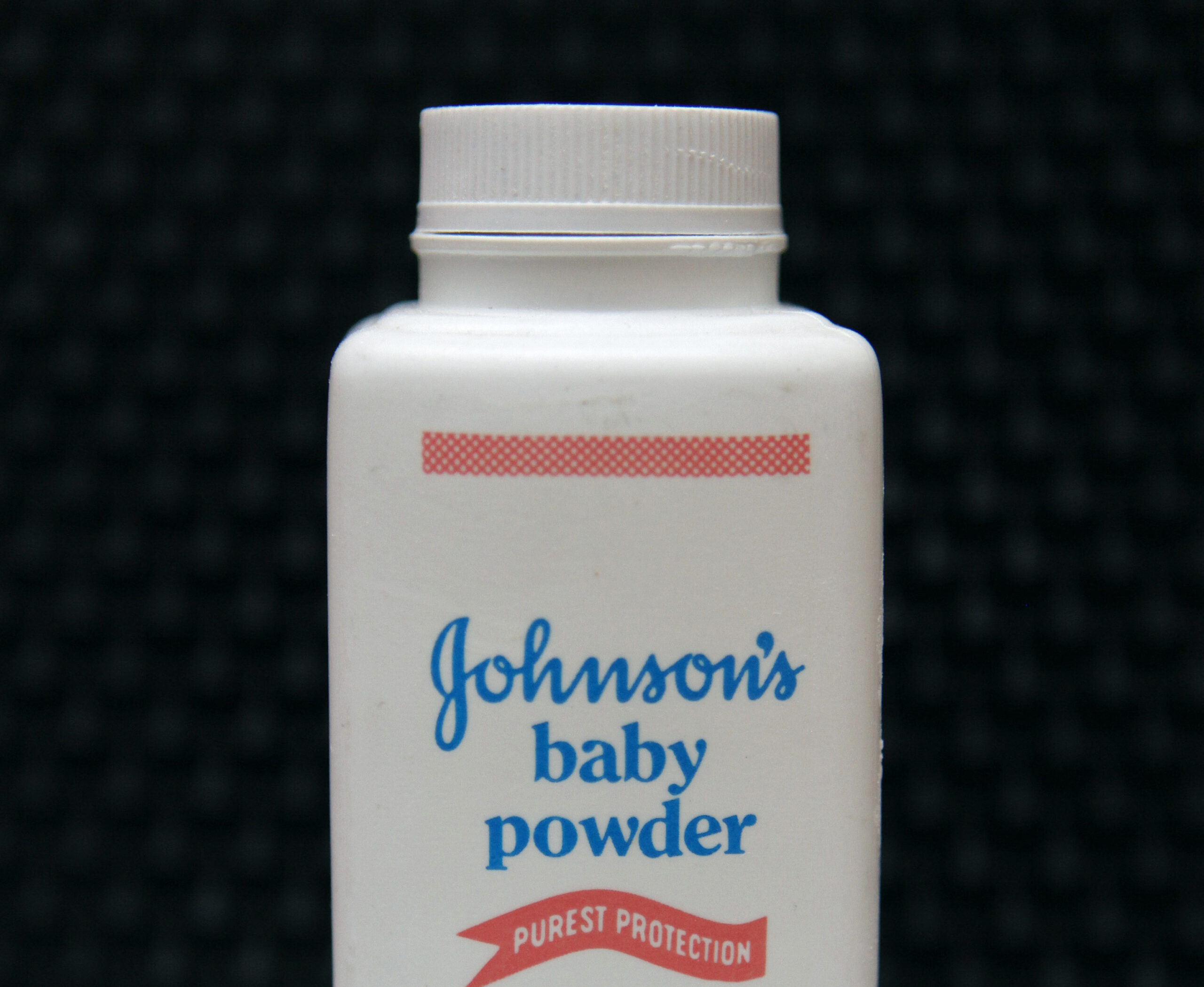 FILE - In this April 15, 2011 file photo, a bottle of Johnson's baby powder is displayed in San Francisco. Johnson & Johnson is pulling its iconic, talc-based Johnson’s Baby Powder from shelves worldwide next year in favor of a product based on cornstarch. The health care giant’s announcement Friday, Aug. 12, 2022, comes two years after it ended talc-based powder sales in the U.S. and Canada, where demand has dwindled amid thousands of lawsuits claiming it had caused cancer (AP Photo/Jeff Chiu, File)