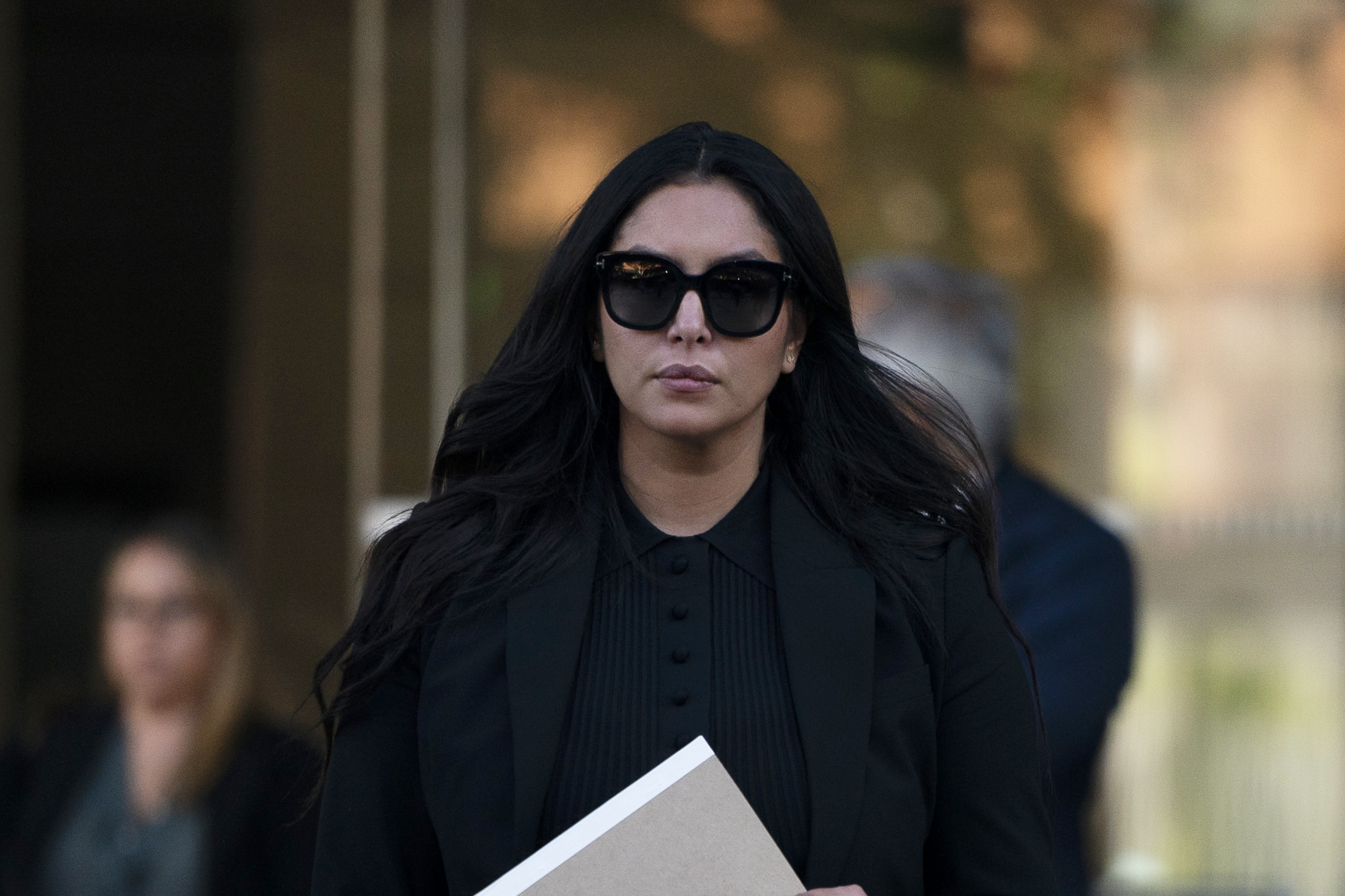 FILE - Vanessa Bryant, the widow of Kobe Bryant, leaves a federal courthouse in Los Angeles, Wednesday, Aug. 10, 2022. A federal jury has found that Los Angeles County must pay Kobe Bryant's widow $16 million over photos of the NBA star's body at the site of the 2020 helicopter crash that killed him. The jurors who returned the verdict Wednesday, Aug. 24, 2022, agreed with Vanessa Bryant and her attorneys that her privacy was invaded when deputies and firefighters took and shared photos of the remains of Kobe Bryant and their 13-year-old daughter Gianna. (AP Photo/Jae C. Hong, File)
