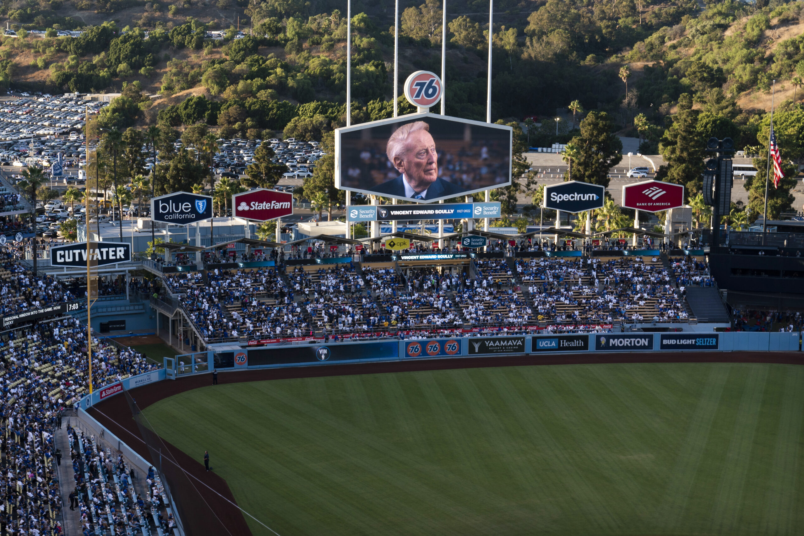 A screen at Dodger Stadium shows late broadcaster Vin Scully during a tribute to him before a baseball game between the Los Angeles Dodgers and the San Diego Padres on Friday, Aug. 5, 2022, in Los Angeles. (AP Photo/Jae C. Hong)