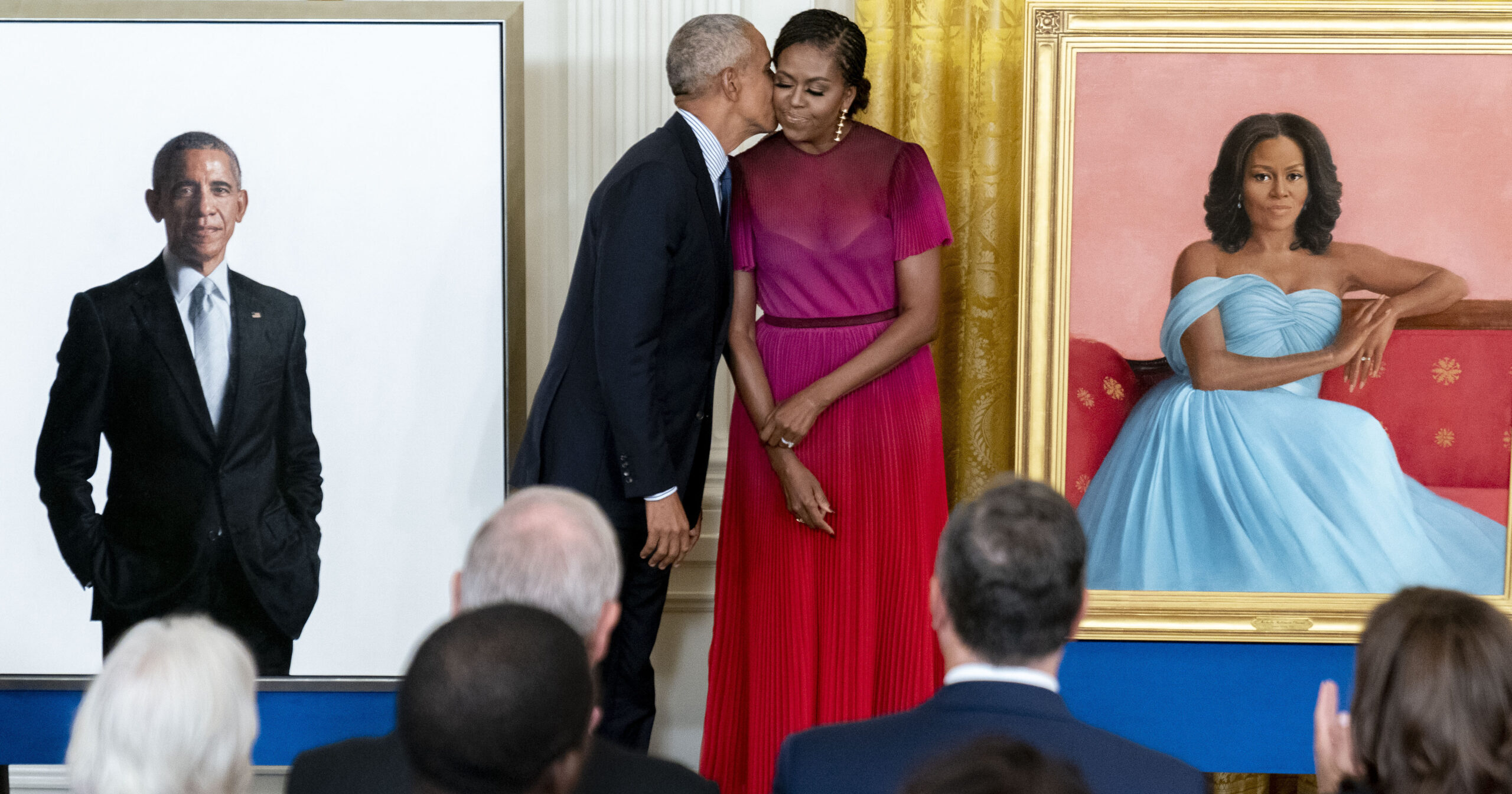 Former President Barack Obama kisses his wife former first lady Michelle Obama after they unveiled their official White House portraits during a ceremony in the East Room of the White House, Wednesday, Sept. 7, 2022, in Washington. (AP Photo/Andrew Harnik)