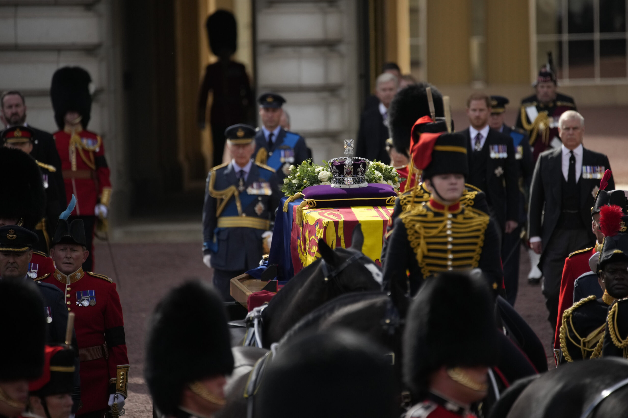 The coffin of Queen Elizabeth II leaves Buckingham Palace for Westminster Hall in London, Wednesday, Sept. 14, 2022. The Queen will lie in state in Westminster Hall for four full days before her funeral on Monday Sept. 19. (AP Photo/Christophe Ena, Pool)