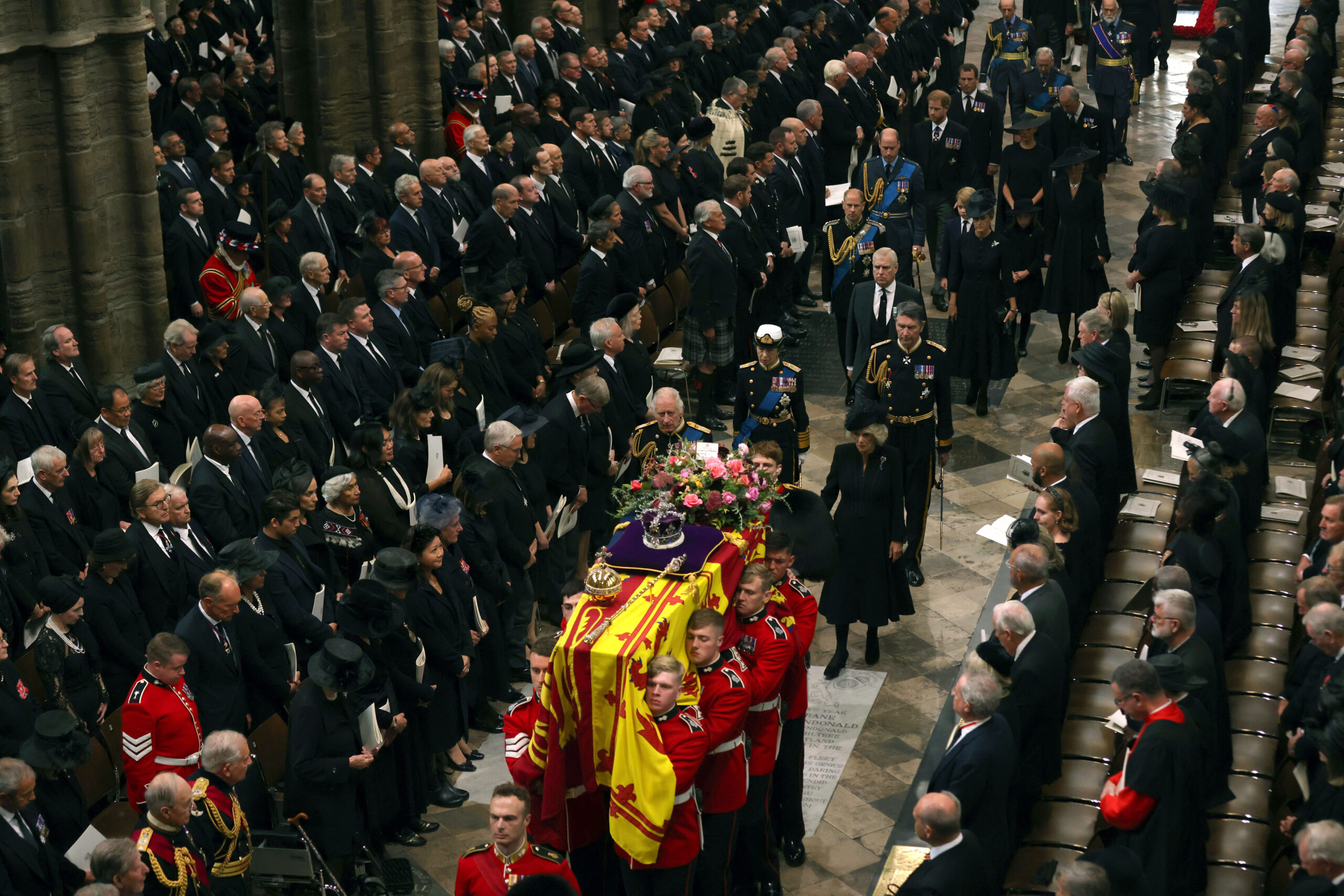 King Charles III, Camilla, Queen Consort and other members of the Royal family follow the coffin of Queen Elizabeth II as it is carried into Westminster Abbey ahead of her State Funeral, in London, Monday Sept. 19, 2022. The Queen, who died aged 96 on Sept. 8, will be buried at Windsor alongside her late husband, Prince Philip, who died last year. (Jack Hill/Pool Photo via AP)