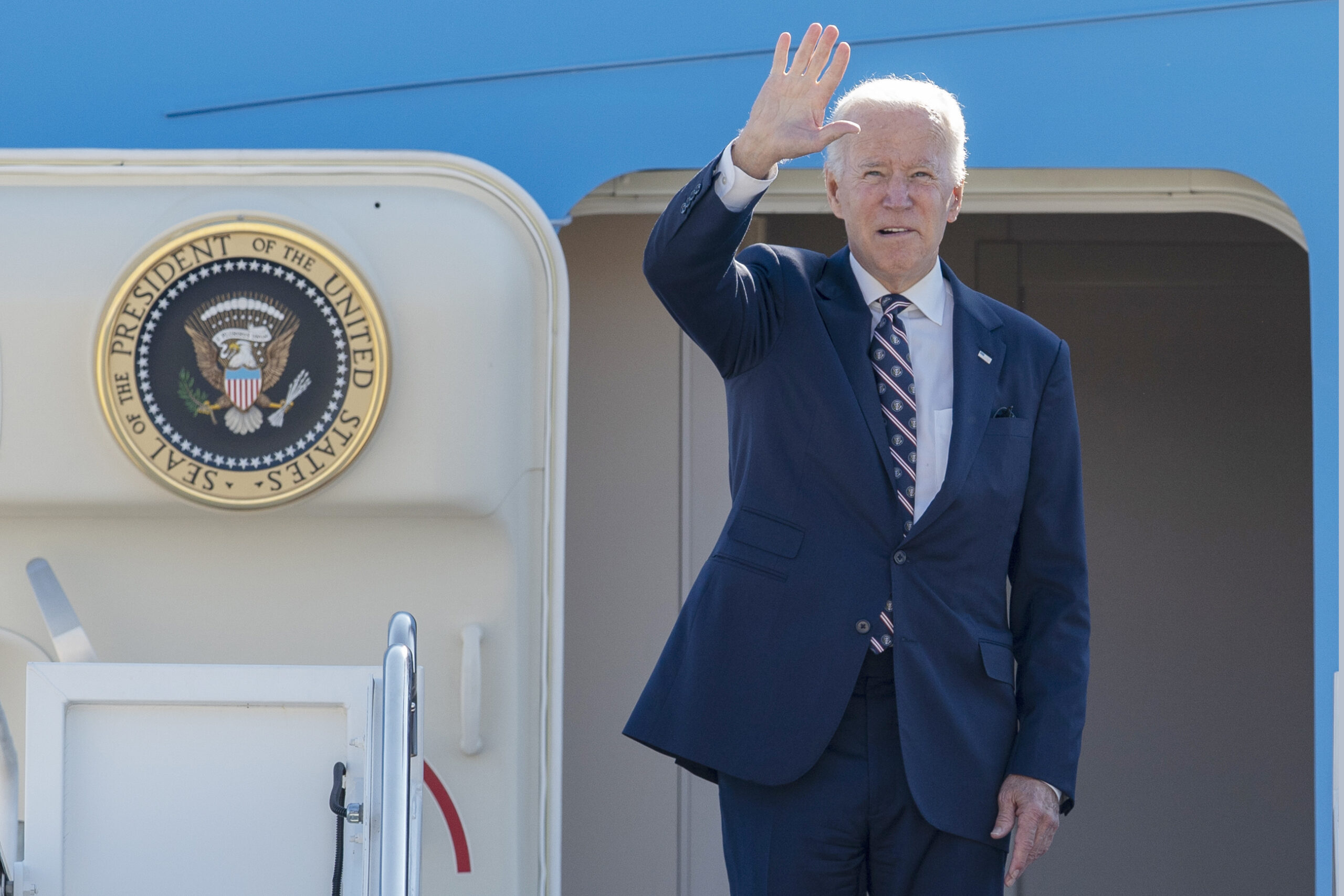 President Joe Biden waves as he boards Air Force One at Andrews Air Force Base, Md., Friday, Sept. 9, 2022, on his way to the groundbreaking of the new Intel semiconductor manufacturing facility in New Albany, Ohio. (AP Photo/Gemunu Amarasinghe)