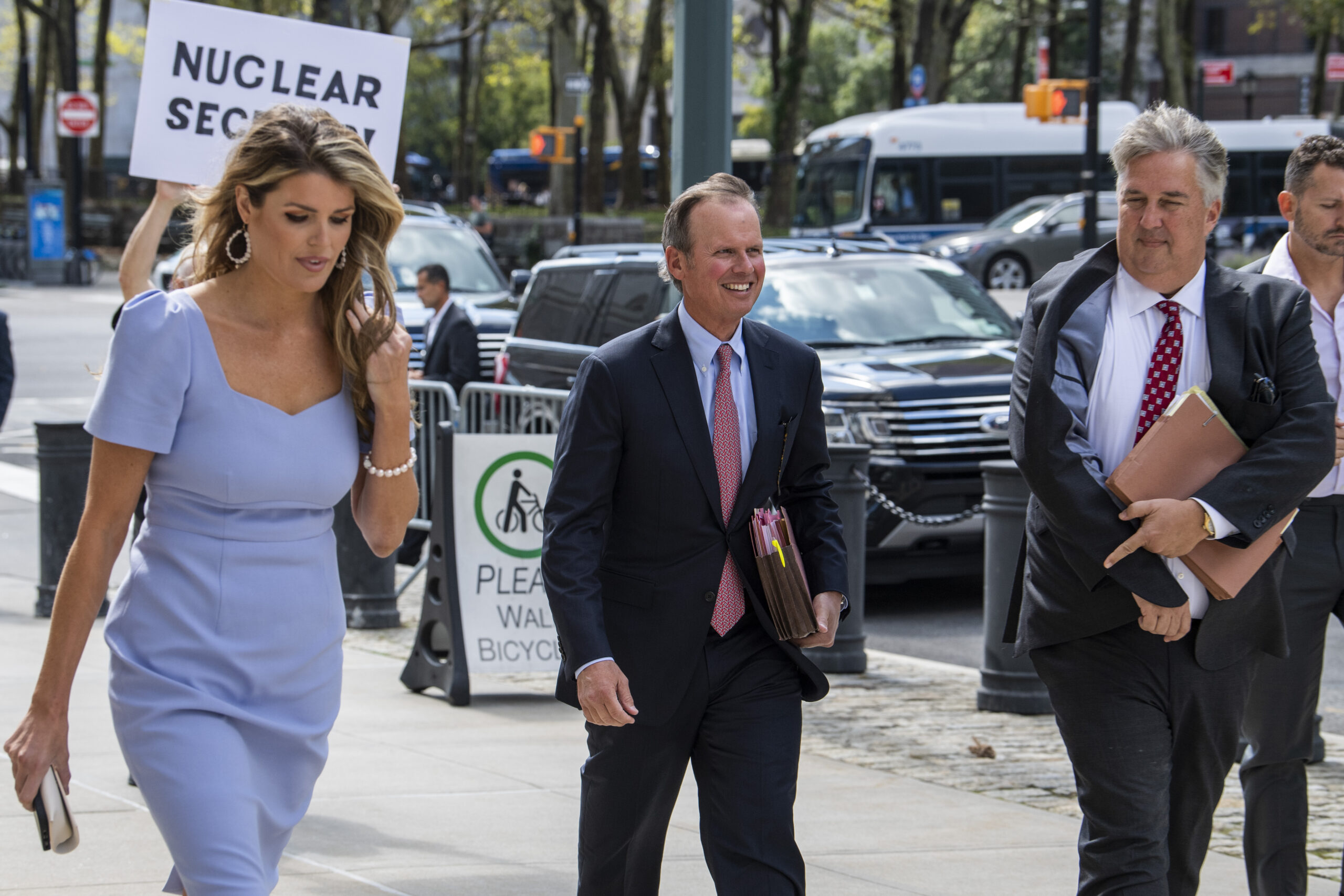 Former President Donald Trump's attorneys Lindsey Halligan, left, Chris Kise, center, and James Trusty arrive at Brooklyn Federal Court, Tuesday, Sept. 20, 2022, in New York. Lawyers for Trump and for the Justice Department are to appear in federal court in Brooklyn on Tuesday before a veteran judge named last week as special master to review the roughly 11,000 documents — including about 100 marked as classified — taken during the FBI's Aug. 8 search of Mar-a-Lago. (AP Photo/Brittainy Newman)
