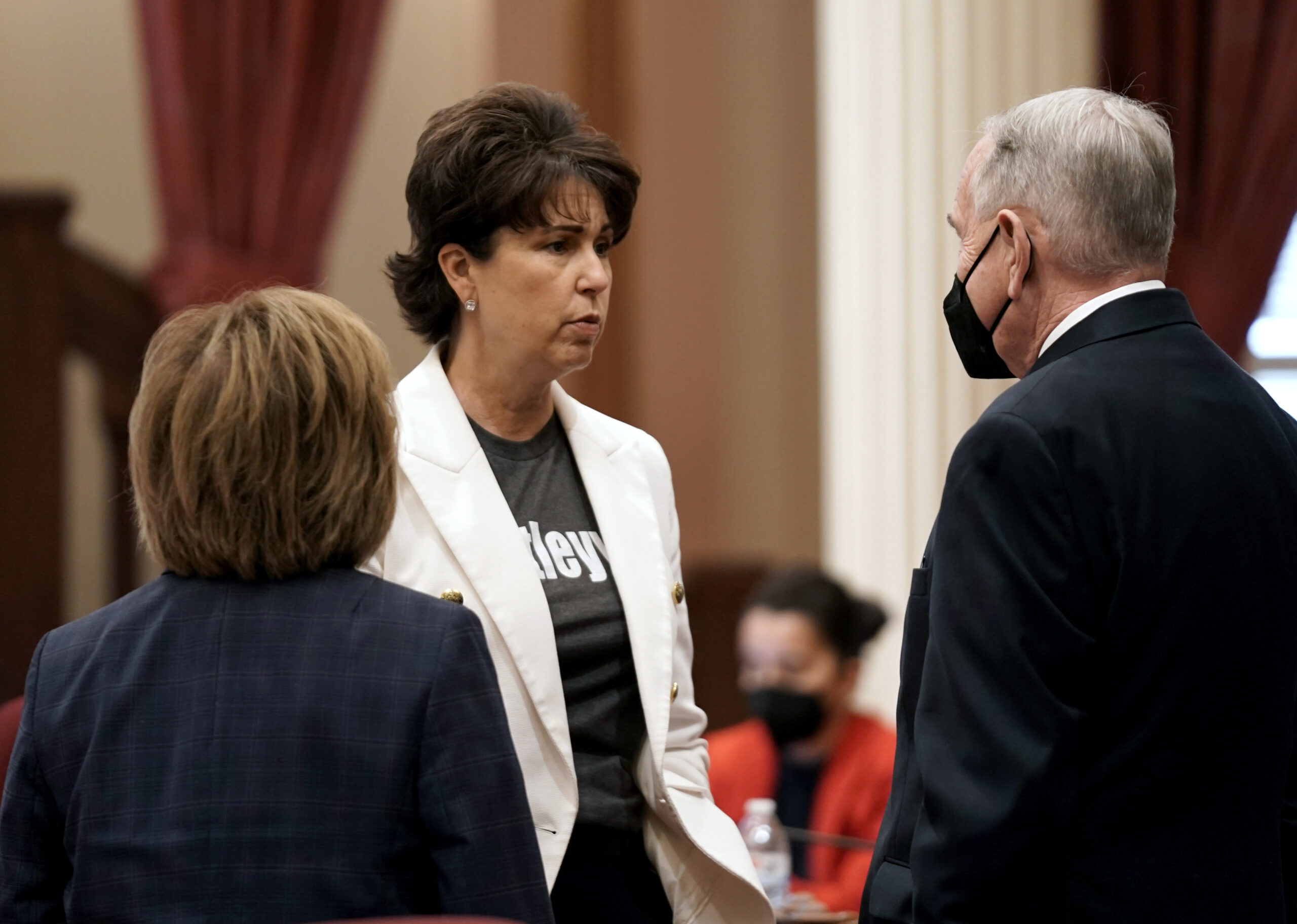 State Sen. Connie Leya, D-Chino, center, talks with fellow Democratic state Senators, Maria Elena Durazo, of Los Angeles, left and Richard Roth, of Riverside, at the Capitol in Sacramento, Calif., Wednesday, Aug. 31, 2022. On Wednesday, California lawmakers, approved Leyva's bill to make vasectomies cheaper for men. (AP Photo/Rich Pedroncelli)