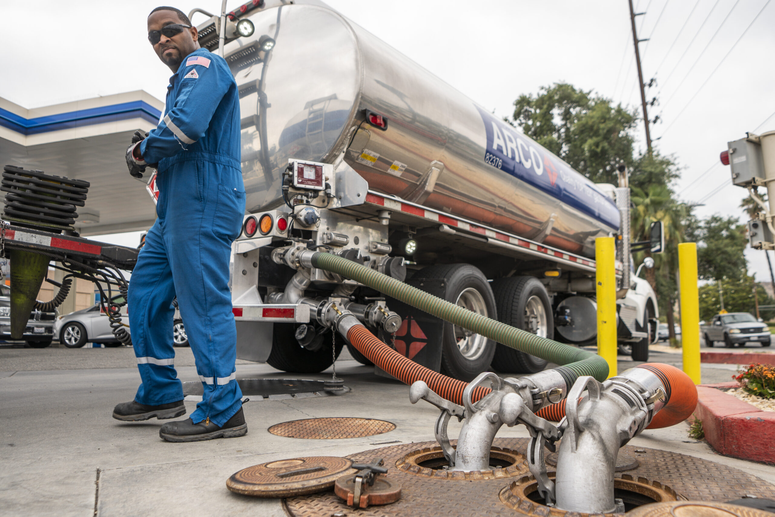 FILE - A driver delivers 8,500 gallons of gasoline at an ARCO gas station in Riverside, Calif., Saturday, May 28, 2022. (AP Photo/Damian Dovarganes, File)
