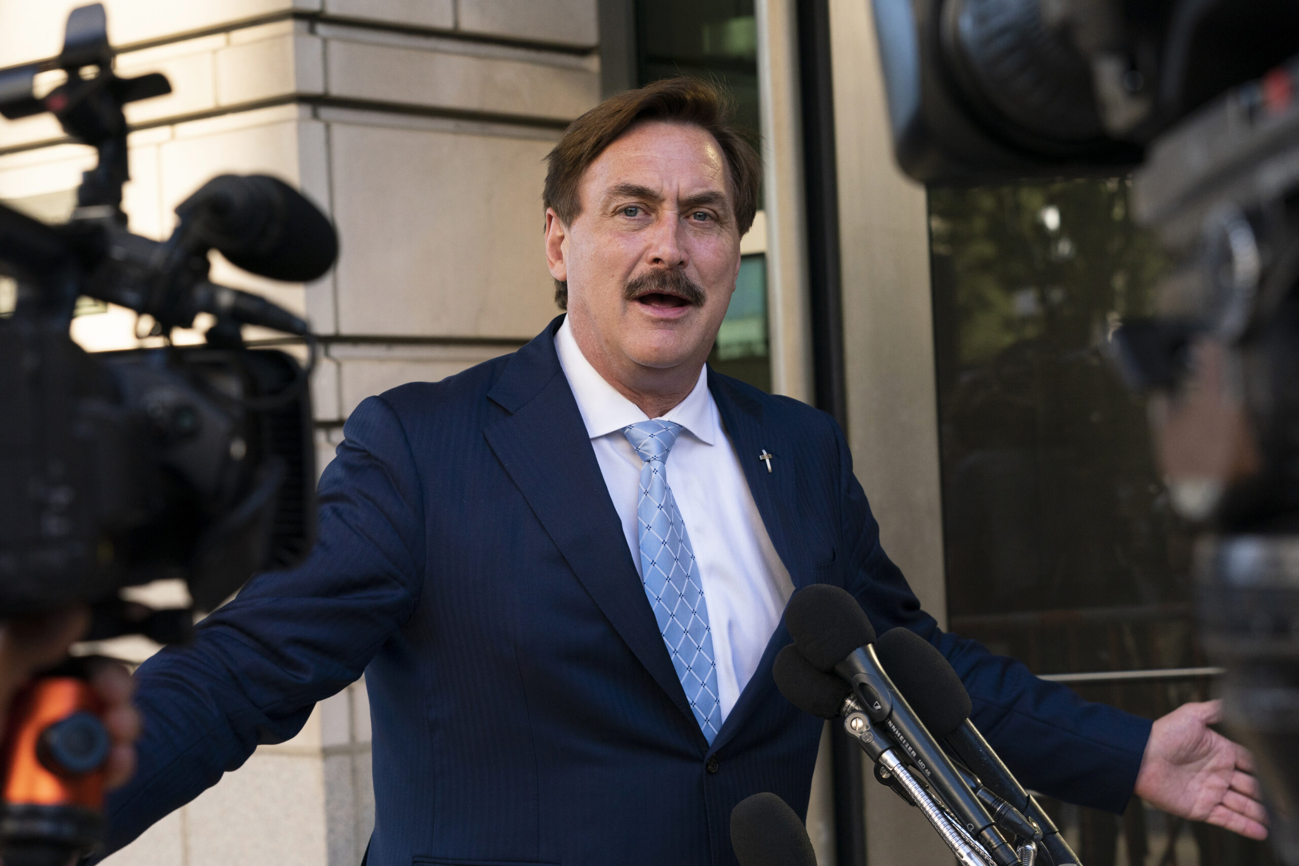 FILE - MyPillow chief executive Mike Lindell speaks to reporters outside federal court in Washington, Thursday, June 24, 2021. On Tuesday, Sept. 13, 2022, Lindell said that federal agents seized his cellphone and questioned him about a Colorado clerk who has been charged in what prosecutors say was a “deceptive scheme” to breach voting system technology used across the country. (AP Photo/Manuel Balce Ceneta, File)