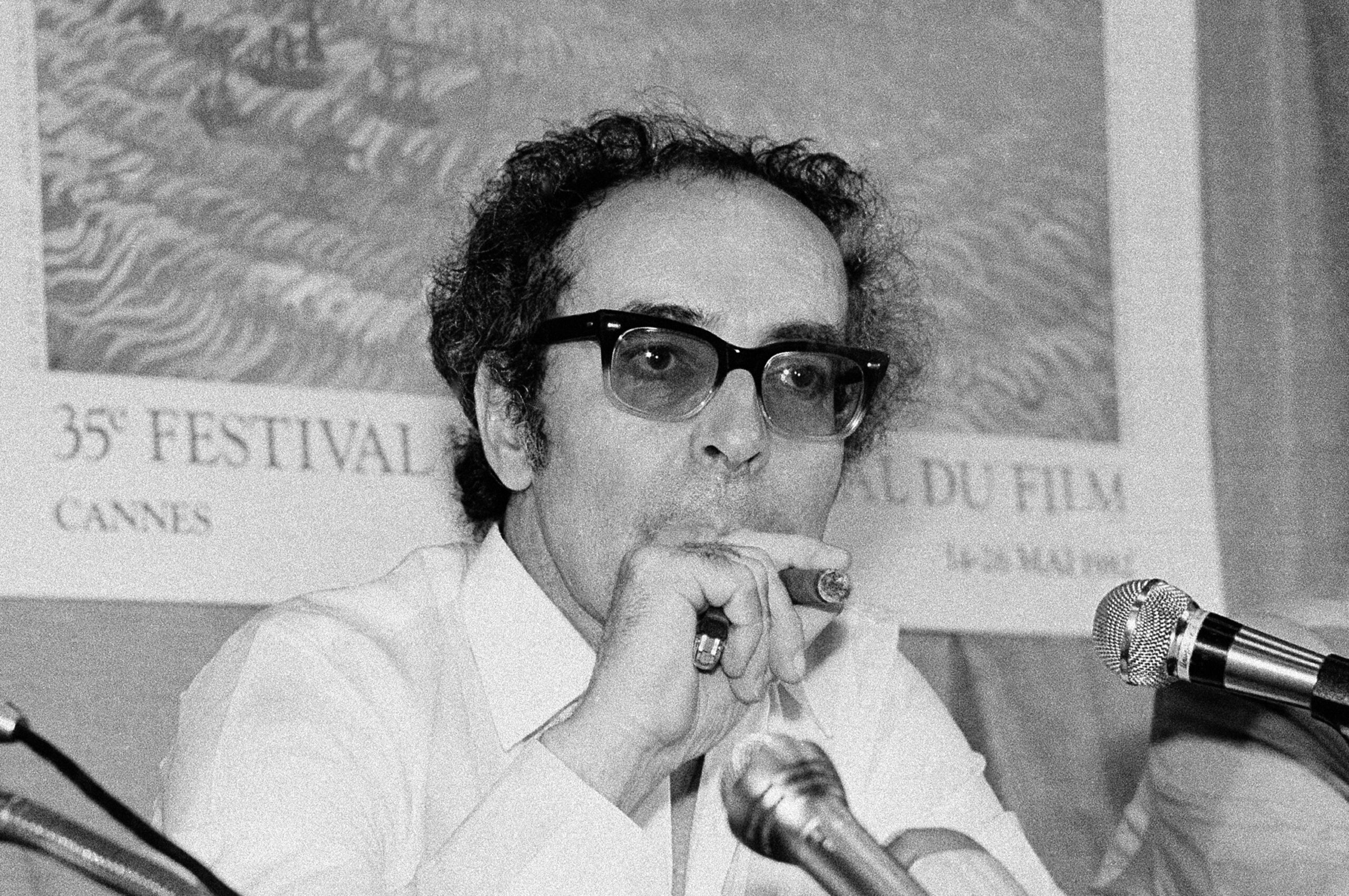 FILE - Film director Jean-Luc Godard smokes at Cannes festival, France on May 25, 1982. Director Jean-Luc Godard, an icon of French New Wave film who revolutionized popular 1960s cinema, has died, according to French media. He was 91. Born into a wealthy French-Swiss family on Dec. 3, 1930, in Paris, the ingenious "enfant terrible" stood for years as one of the world's most vital and provocative directors in Europe and beyond — beginning in 1960 with his debut feature "Breathless." (AP Photo/Jean-Jacques Levy, File)