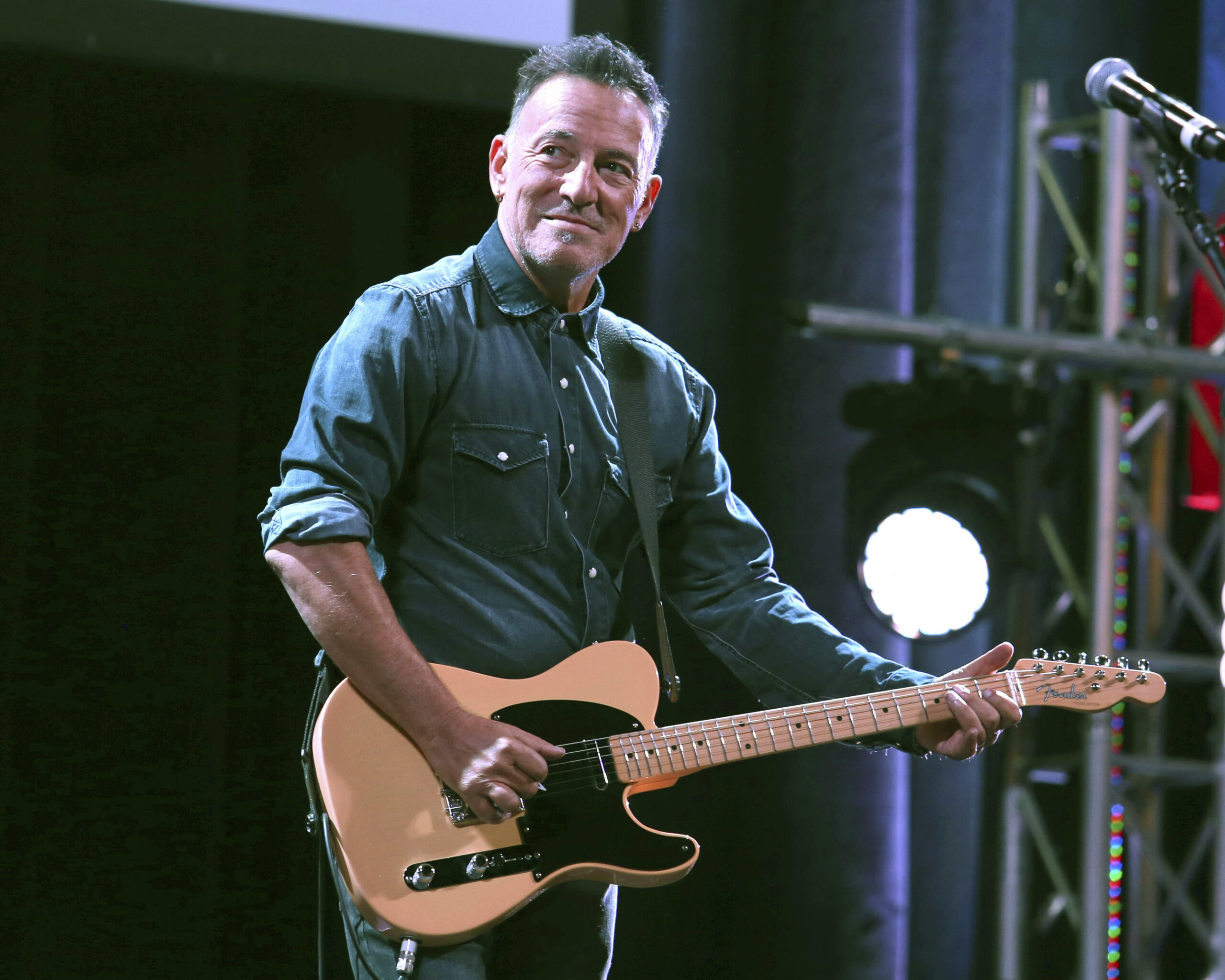 FILE - Bruce Springsteen performs at Stand Up For Heroes in New York on Nov. 1, 2016. Springsteen’s most memorable artifacts will travel across the country with a new landing spot in Los Angeles. The Grammy Museum announced Wednesday that Bruce Springsteen Live! will open at the Grammy Museum L.A. Live in downtown Los Angeles on Oct. 15. (Photo by Greg Allen/Invision/AP, File)
