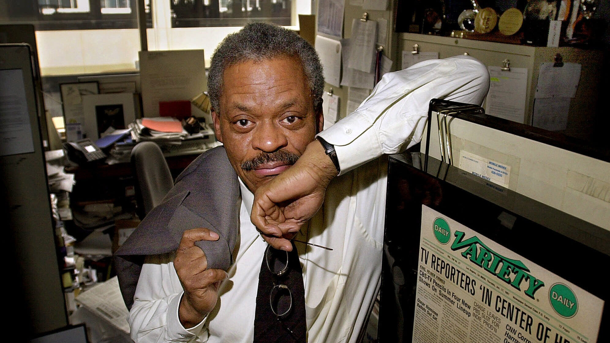 FILE - CNN anchor Bernard Shaw poses in his office at CNN's Washington bureau on Feb. 15, 2001. Shaw, who was CNN's original chief anchor when the network started in 1980, died of pneumonia in Washington on Wednesday, Sept. 7, 2022, according to Tom Johnson, the network's former chief executive. Shaw was 82. (AP Photo/Alex Brandon, File)