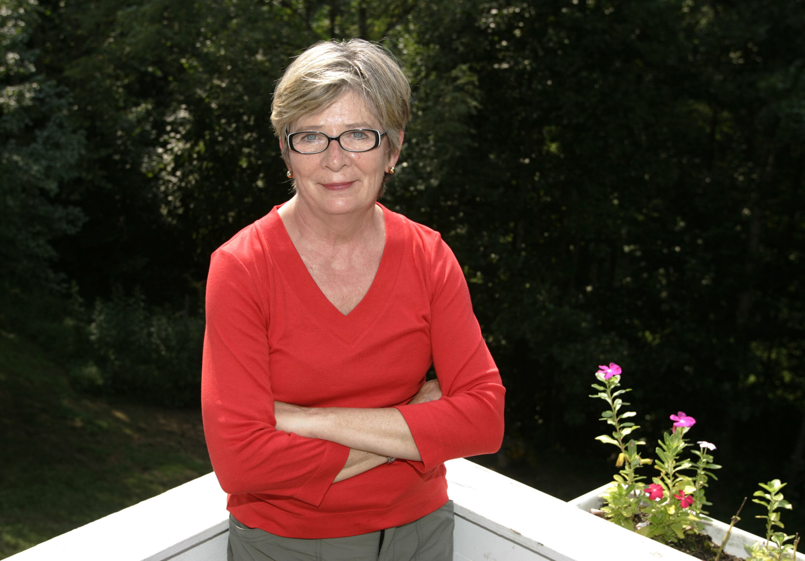 FILE - Author Barbara Ehrenreich poses at her home in Charlottesville, Va., on Aug. 25, 2005. Ehrenreich, the muckraking author, activist and journalist who in such notable works as “Nickel and Dimed” and “Bait and Switch" challenged conventional thinking about class, religion and the very idea of an American dream, died Thursday morning, Sept. 1, 2022 in Alexandria, Virginia, according to her son. She was 81. (AP Photo/Andrew Shurtleff, File)