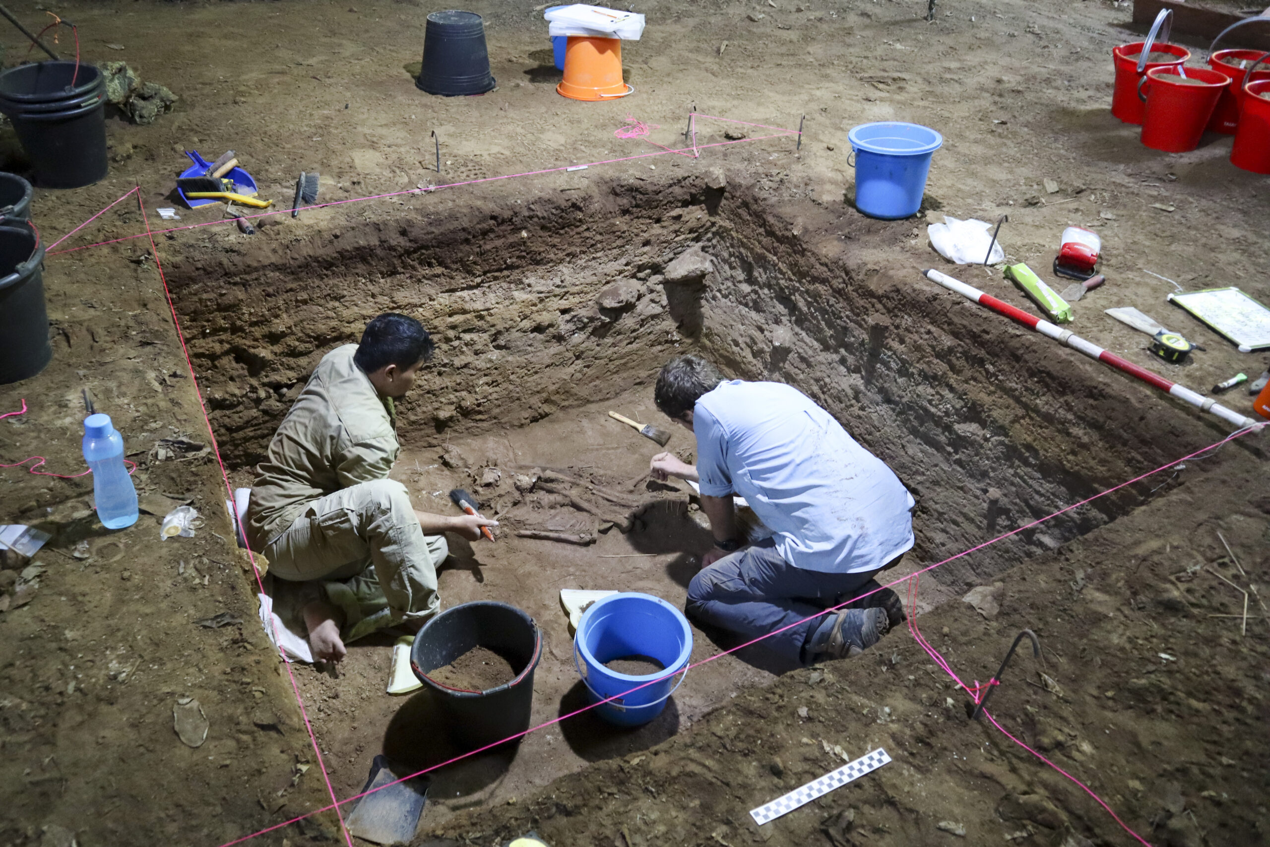 Dr Tim Maloney and Andika Priyatno work at the site in a cave in East Kalimantan, Borneo, Indonesia, March 2, 2020. The remains, which have been dated to 31,000 years old, mark the oldest evidence for amputation yet discovered. And the prehistoric “surgery” could show that humans were making medical advances much earlier than previously thought, according to the study published Wednesday, Sept. 7, 2022 in the journal Nature.(Tim Maloney/Griffith University via AP)