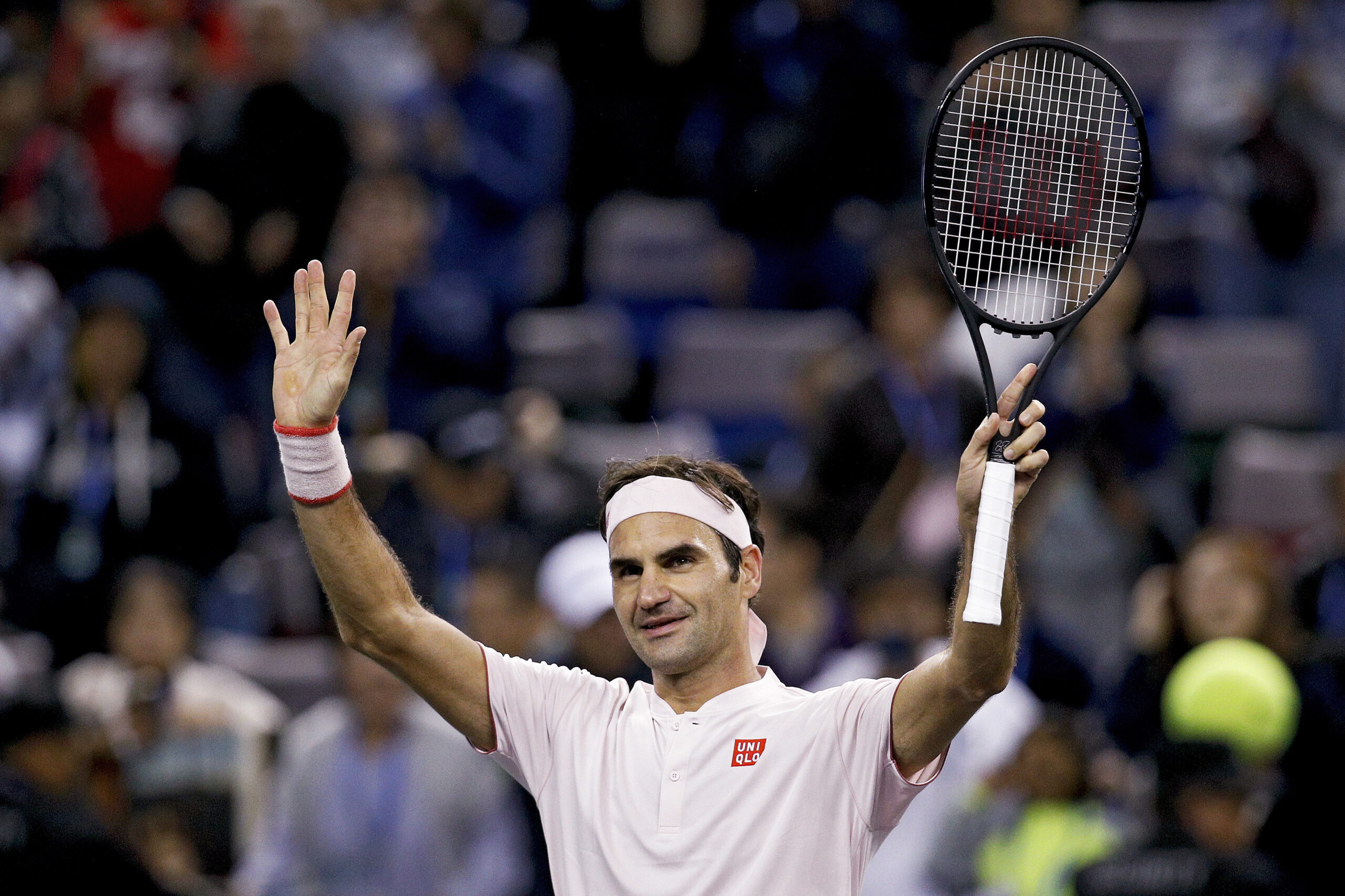 FILE - Roger Federer of Switzerland waves to spectators after defeating Daniil Medvedev of Russia in their men's singles match of the Shanghai Masters tennis tournament at Qizhong Forest Sports City Tennis Center in Shanghai, China, Oct. 10, 2018. Federer announced Thursday, Sept. 15, 2022 he is retiring from tennis. (AP Photo/Andy Wong, File)
