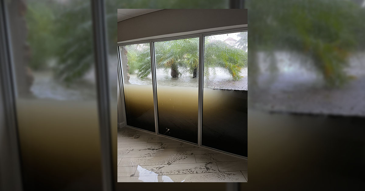 A photograph shows three windows holding back floodwaters from Hurricane Ian, according to Reddit.