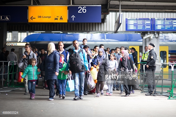 MUNICH CENTRAL STATION, MUNICH, BAVARIA, GERMANY - 2015/09/13: New arrivers enter the registration point. Even though Germany announced - and has by now - closed down its borders for refugees, asylum seekers keep coming to Munich Central Station. There is vast humanitarian support by the citizens of Munich. (Photo by Michael Trammer/Pacific Press/LightRocket via Getty Images)